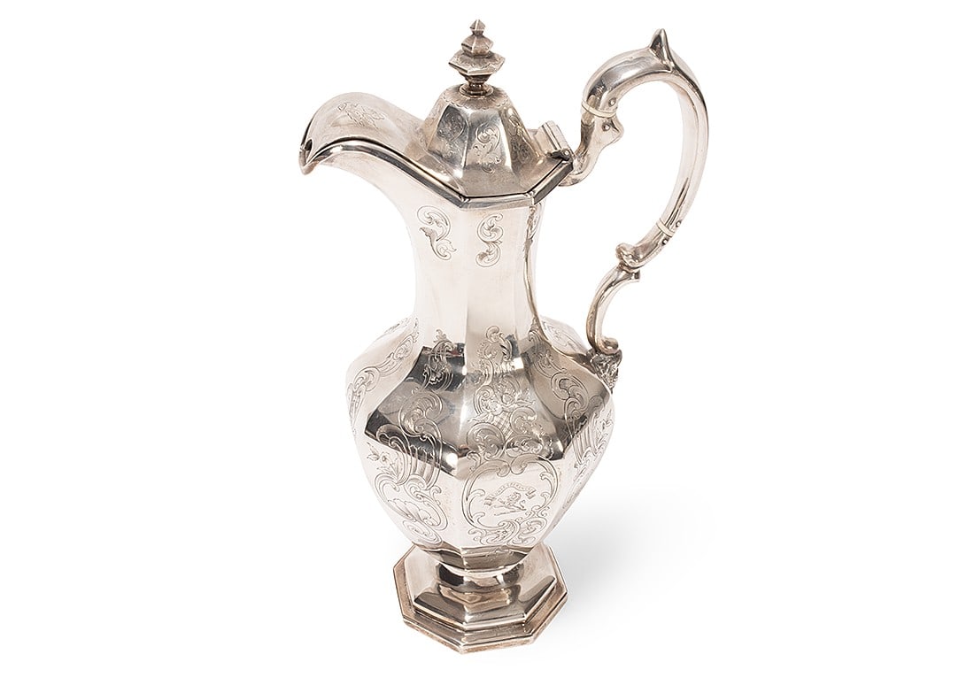 Impressive Scottish Victorian Sterling Silver Claret Jug,: hallmarked Edinburgh, 1845, WR.C (Walker Crichton), with a hinged cover set with stepped finial, above a facetted baluster body, with engraved lion crest beneath banner reading Sur Esperance (translat