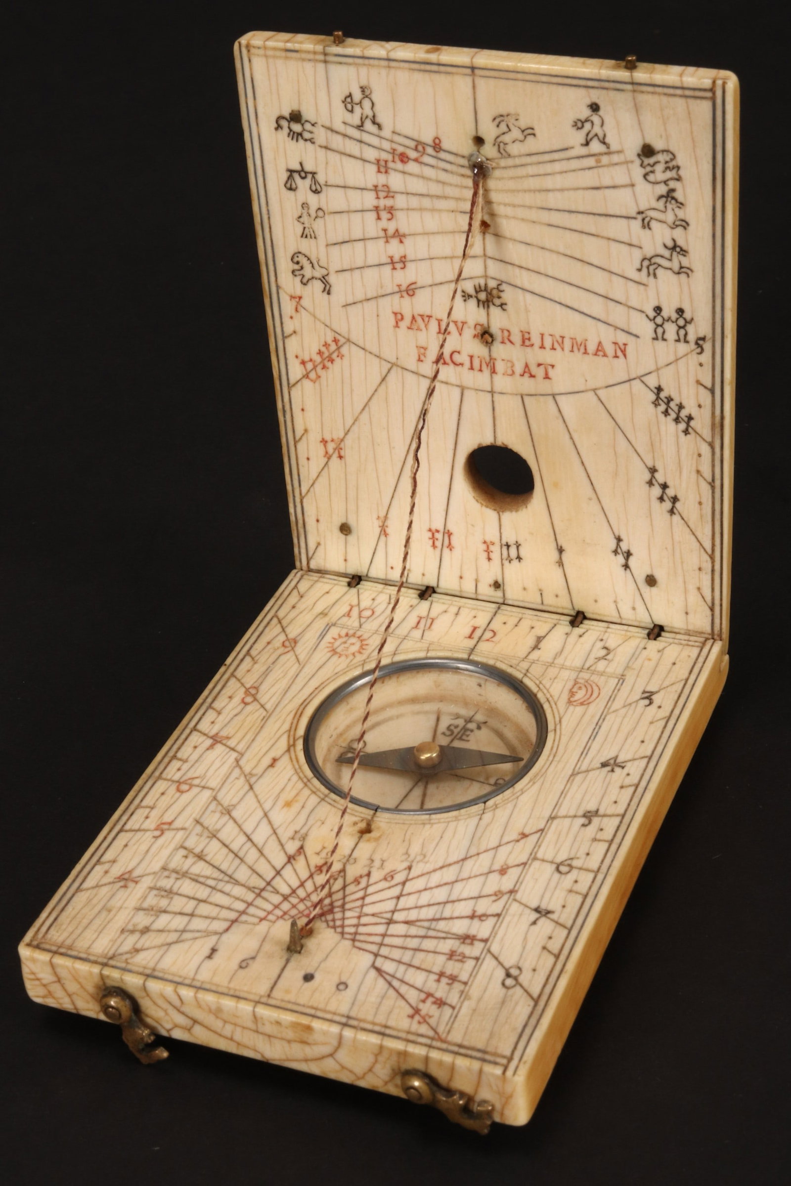 Extremely Rare Early 16th Century Diptych Sun Dial and Compass, c.1600,: by Paulus Reinman, Nuremberg, Germany of rectangular form, the cover set with a wind rose featuring cardinal directions such as 'Nort' for North and 'Ost' for East, with compass viewing aperture, open
