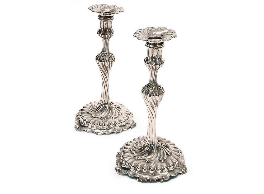 Pair of Heavy George II Cast Sterling Silver Candlesticks,: hallmarked London, 1757, crowned E W (Edward Wakelin), of lobed spiralling form, the single sconce set above a knopped support, raised on a spreading base, total weight 1770g, height 27cm (2)