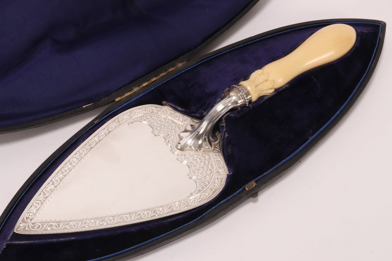Wonderful Victorian Sterling Silver Cake Slice,: hallmarked Birmingham, 1874, H&T (Hilliard & Thomason), the heavy blade with engraved acanthus and c-scroll decoration, accented with bright cut borders, the turned handle accented with lappet border,