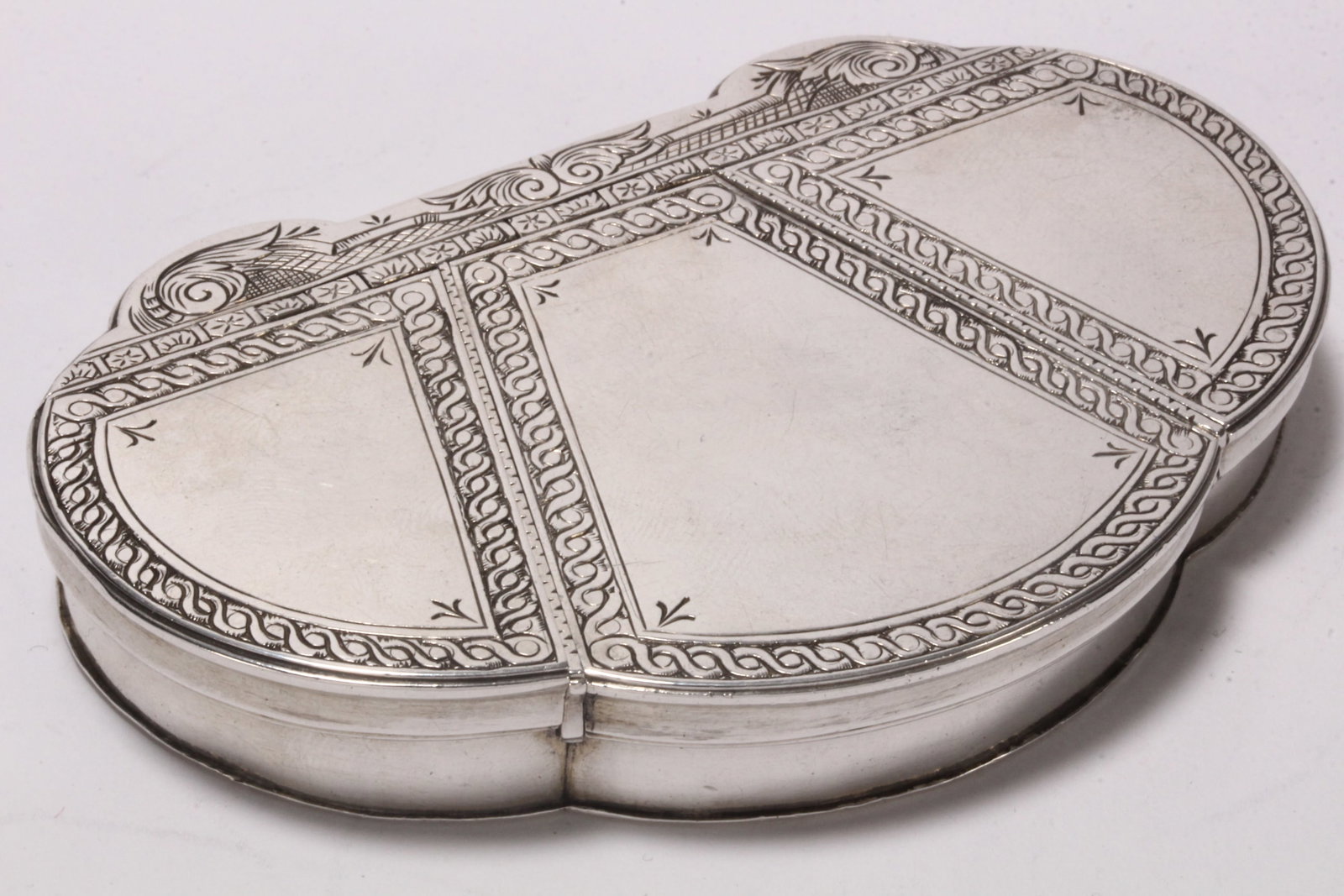 Rare and Early 18th Century English Sterling Silver Triple Opening Snuff Box,: unmarked, probably London, c.1720, of scalloped form, set with three hinged covers decorated with acanthus and trellis borders, opening to separate compartments, total weight 89g, length 9.5cm x 6cm C