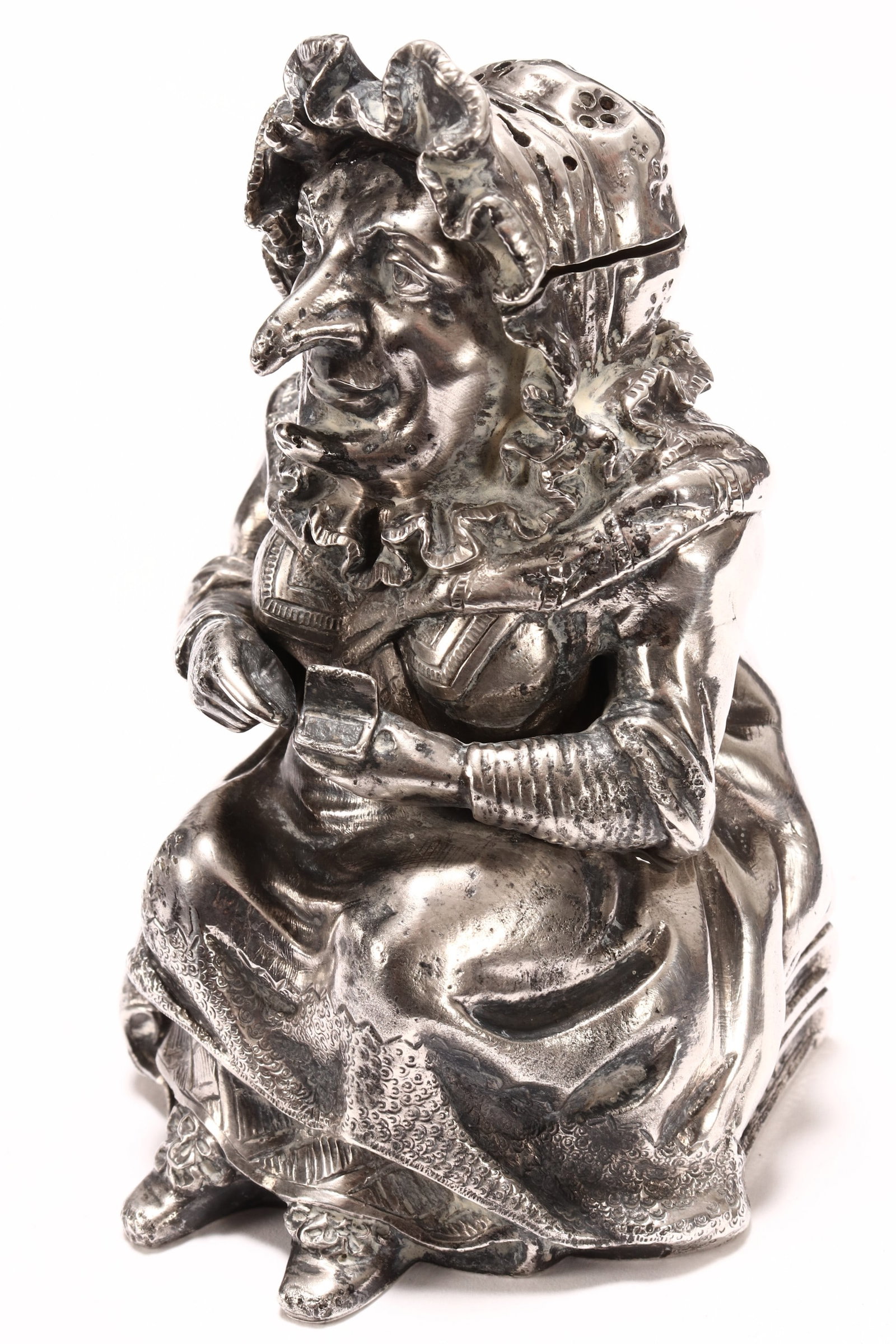 Victorian Sterling Silver 'Judy' Salt Shaker,: hallmarked London, 1881, TJ (Thomas Johnson II), depicting Judy seated with her head slightly turned, total weight 173g, height 8.5cm