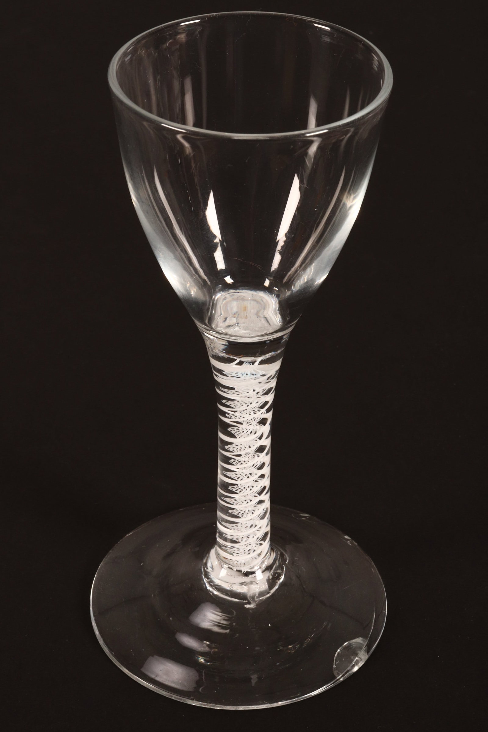18th Century British Opaque Twist Wine Glass, c.1765,: with funnel bowl and central corkscrew surrounded by double spiral twists, on a circular foot, a/f, height 15cm