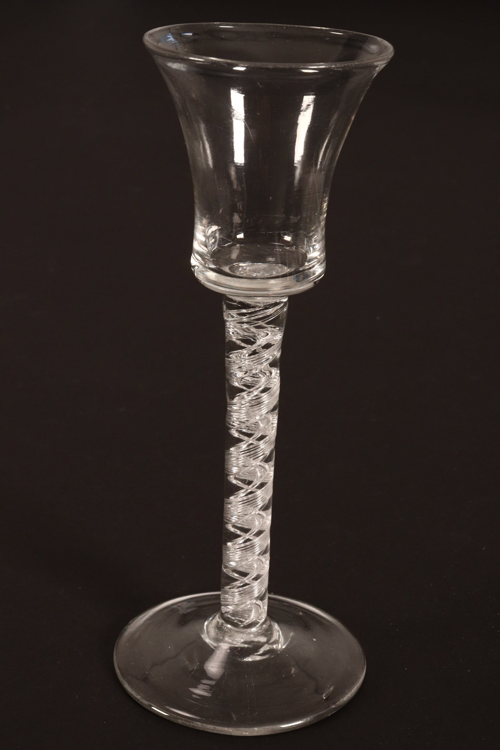 18th Century British Air Twist Wine Glass, c.1760,: with bell shaped bowl, above an air twist stem, on a conical foot, height 16cm
