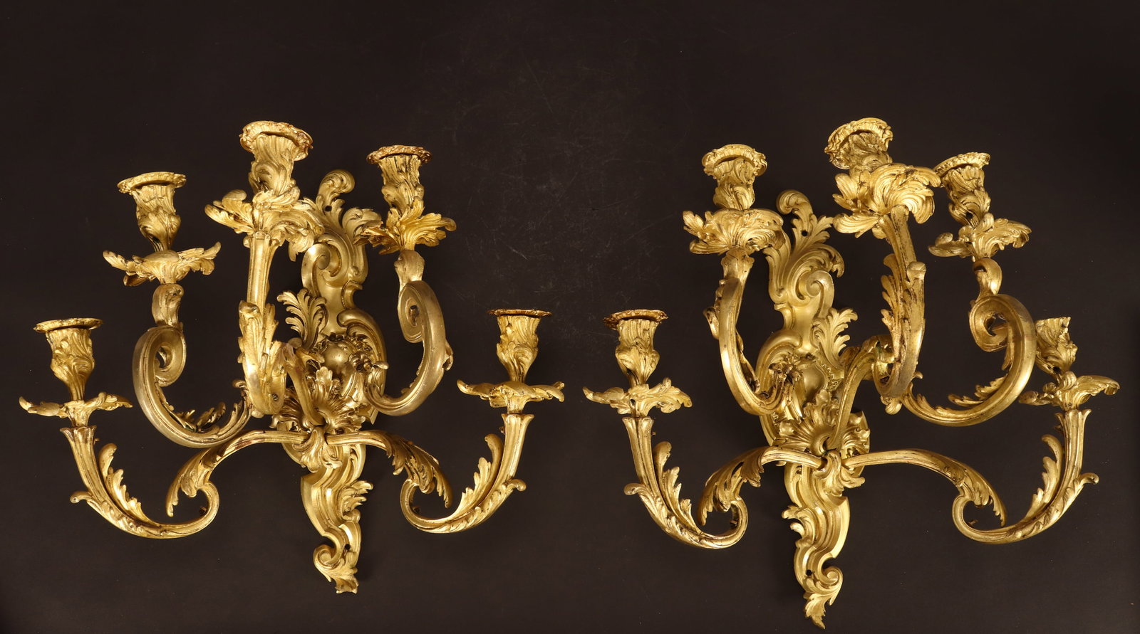 Pair of 19th Century French Louis XV Style Gilt Wall Sconces,: each with five scrolled branches accented with acanthus, length 45cm and width 52cm (2)