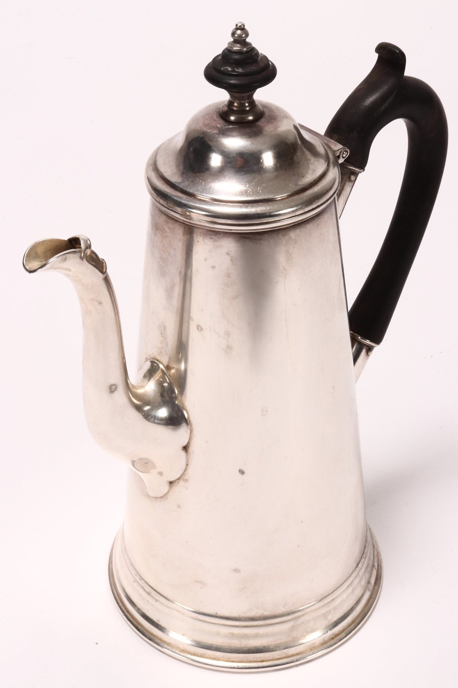 Victorian Sterling Silver Coffee Pot,: hallmarked London, 1880, J.W.D (James Dixon & Sons (James Willis Dixon), the hinged domed cover set with wooden finial, raised on a plain tapered body and stepped circular base, with turned wooden han