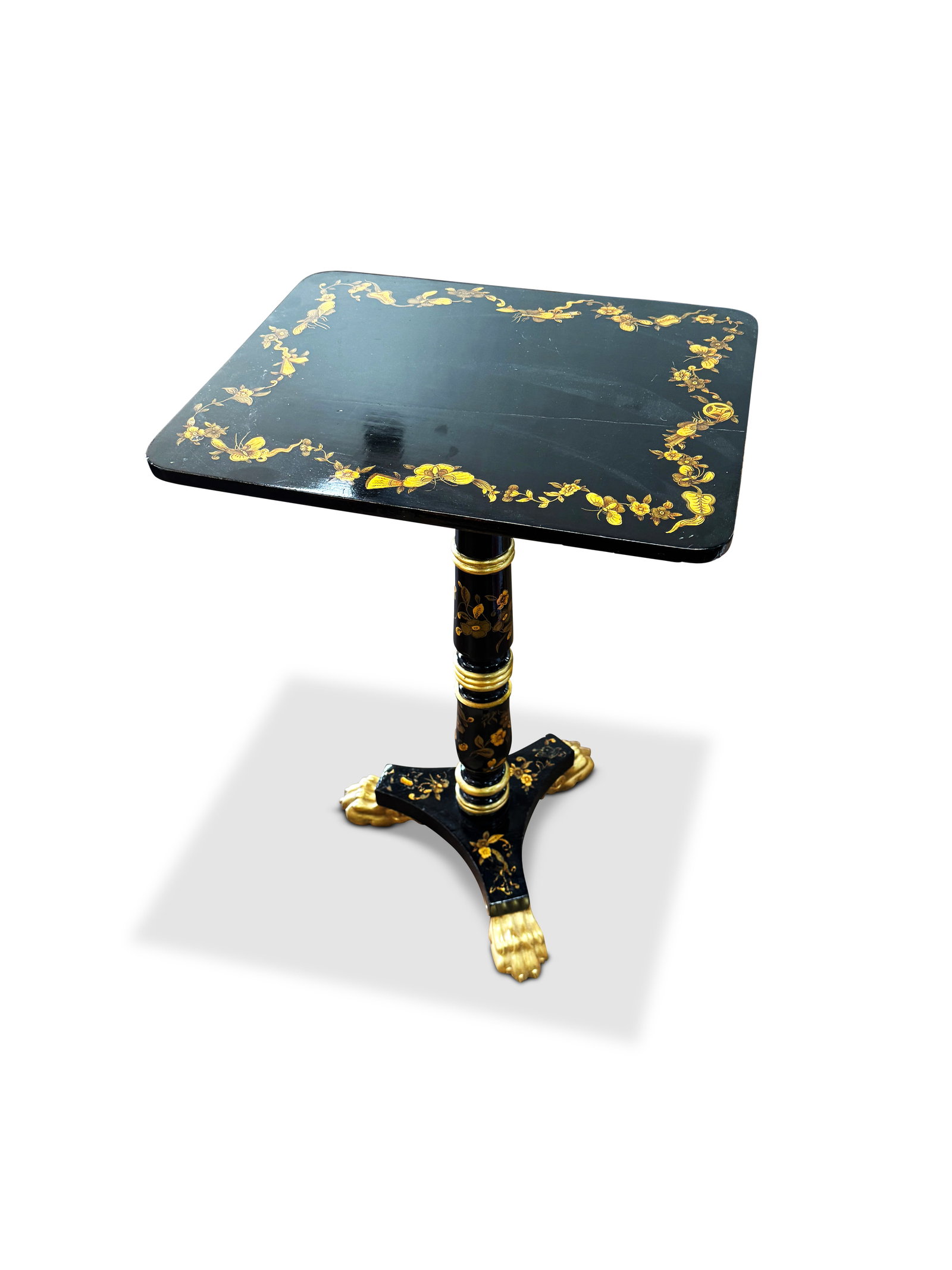 Chinoiserie Black Lacquer and Gilt Occasional Table,: set with a rectangular top, decorated with a border of butterflies and flowers, above a turned support on trefoil base, raised on three gilt lion paw feet, 70cm x 36cm x 47cm