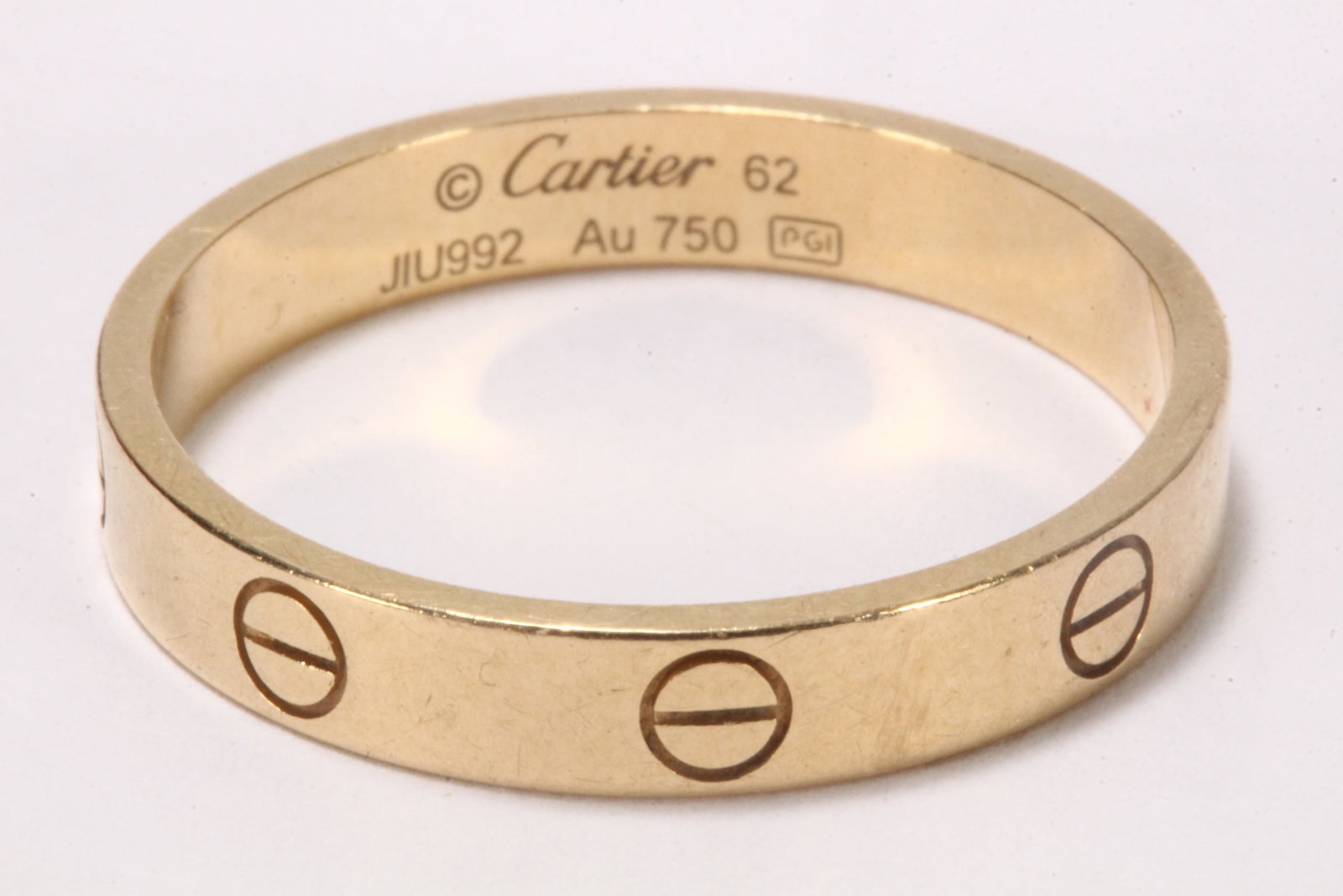 Cartier 18ct Gold Love Ring,: stamped Cartier, JIU992, Au750, size 62 (U), total weight 4g, includes original box, cover, carry bag, certificate with matching serial number and purchase receipt dated 2019
