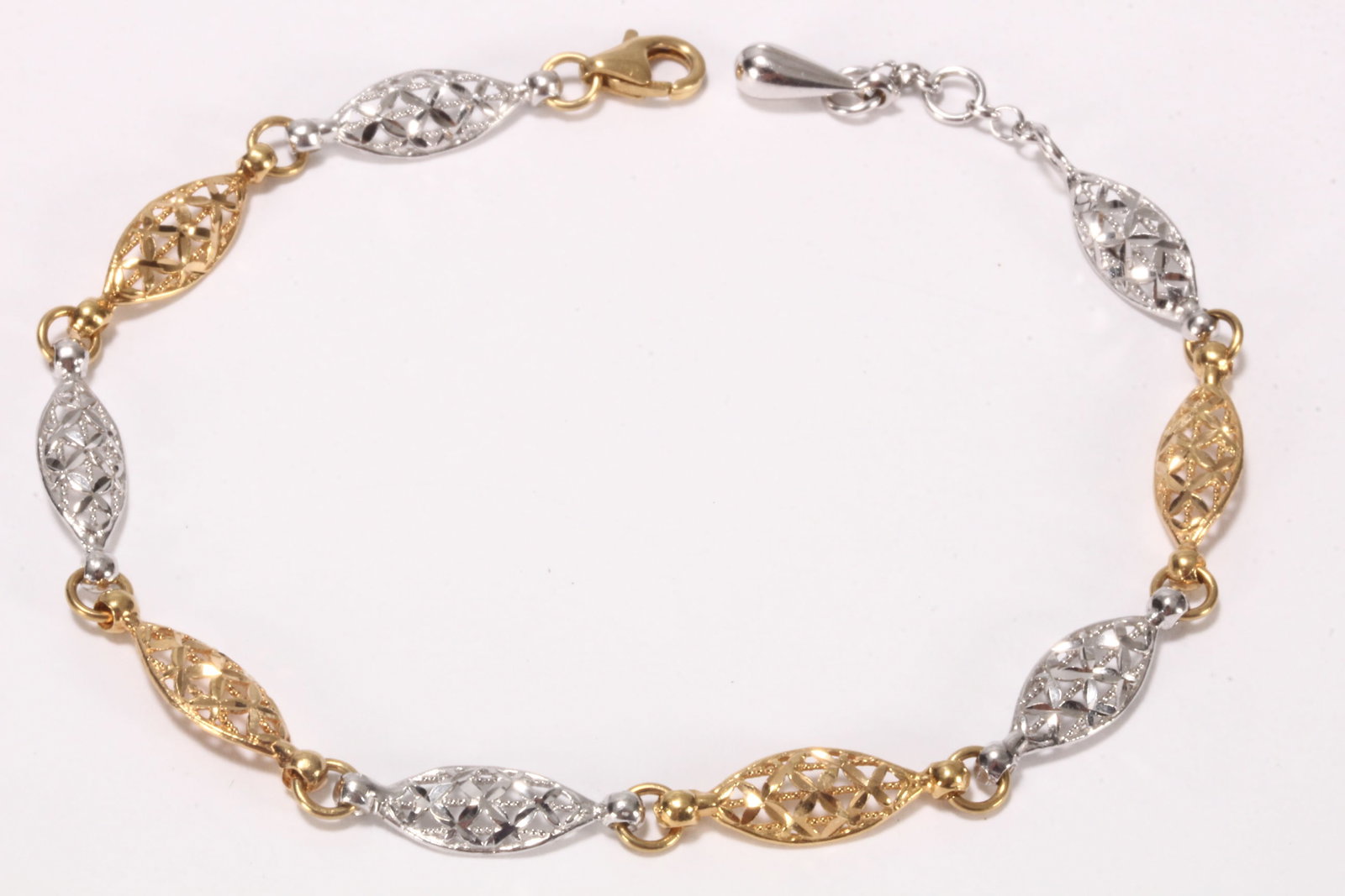 Italian 18ct Duotone Gold Bracelet,: stamped 750, featuring nine elliptical pierced links, in white and yellow gold, with adjustable length, total length 21.5cm, minimum length 19cm, total weight 7.1g