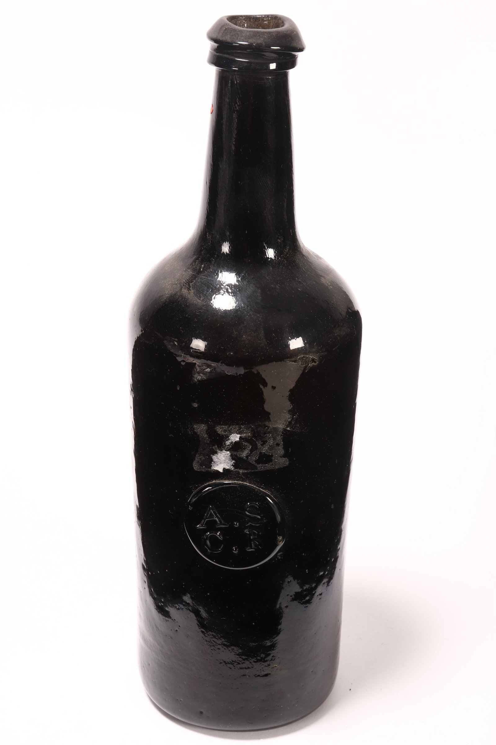 19th Century Black Glass Bottle,: with A.S/C.R (All Souls Common Room) seal to body, height 27.5cm