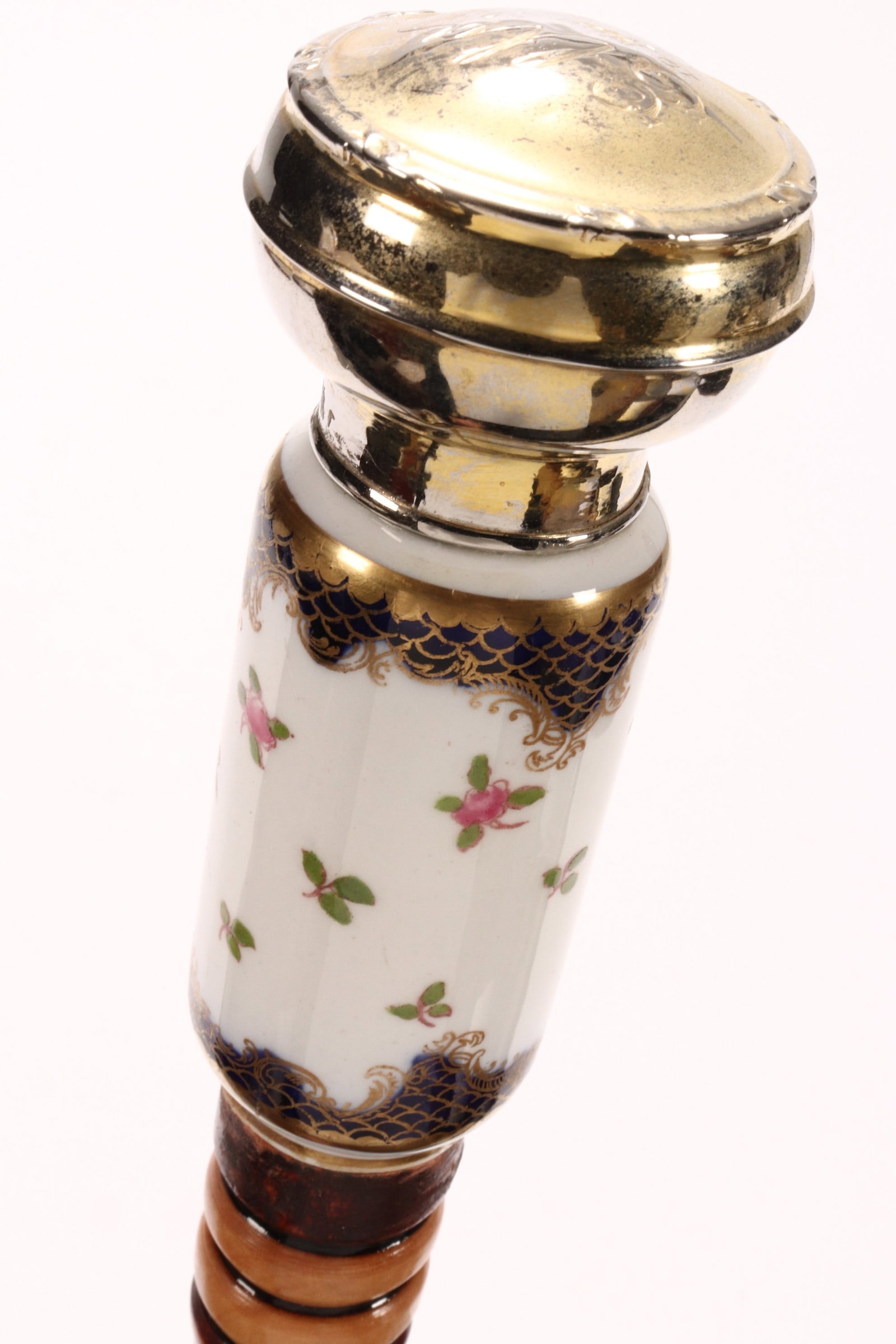 Walking Stick,: with gilt and porcelain handle, above a turned and spiraled handle, length 99cm