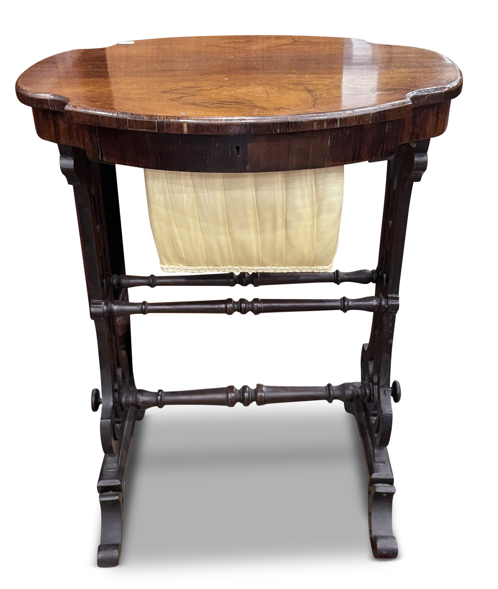 Victorian Rosewood Sewing/Work Table,: with a shaped oval top, above a narrow pull out drawer opening to compartment, raised on two carved and pierced supports, united by a turned stretcher on four swept feet, a/f, 68cm x 52cm x 41cm Prove