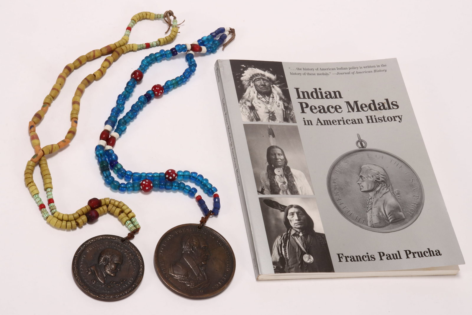 Two Restrike Indian Peace Medals,: depicting President Ulysses S. Grant in profile above a Native American peace pipe surrounded by the text 'United States of America//Let Us Have Peace//Liberty Justice and Equality,' the verso depicti