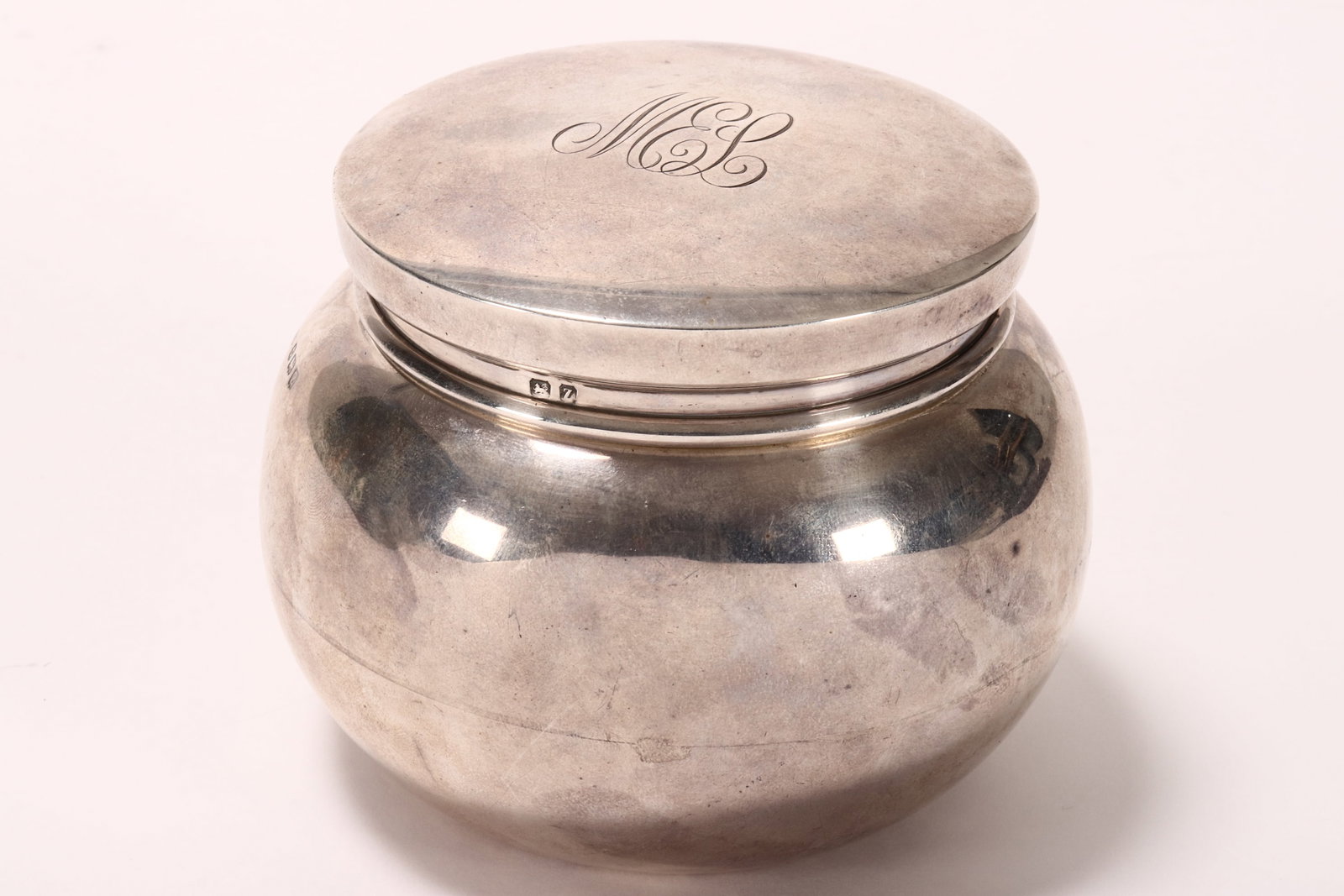 George V Sterling Silver Box and Cover,: hallmarked Birmingham, 1924, H BRs (marked Hardy Bros to base), of globular form, decorated with engraved monogram to cover, opening to reveal a gilt interior, total weight 151g, height 8cm