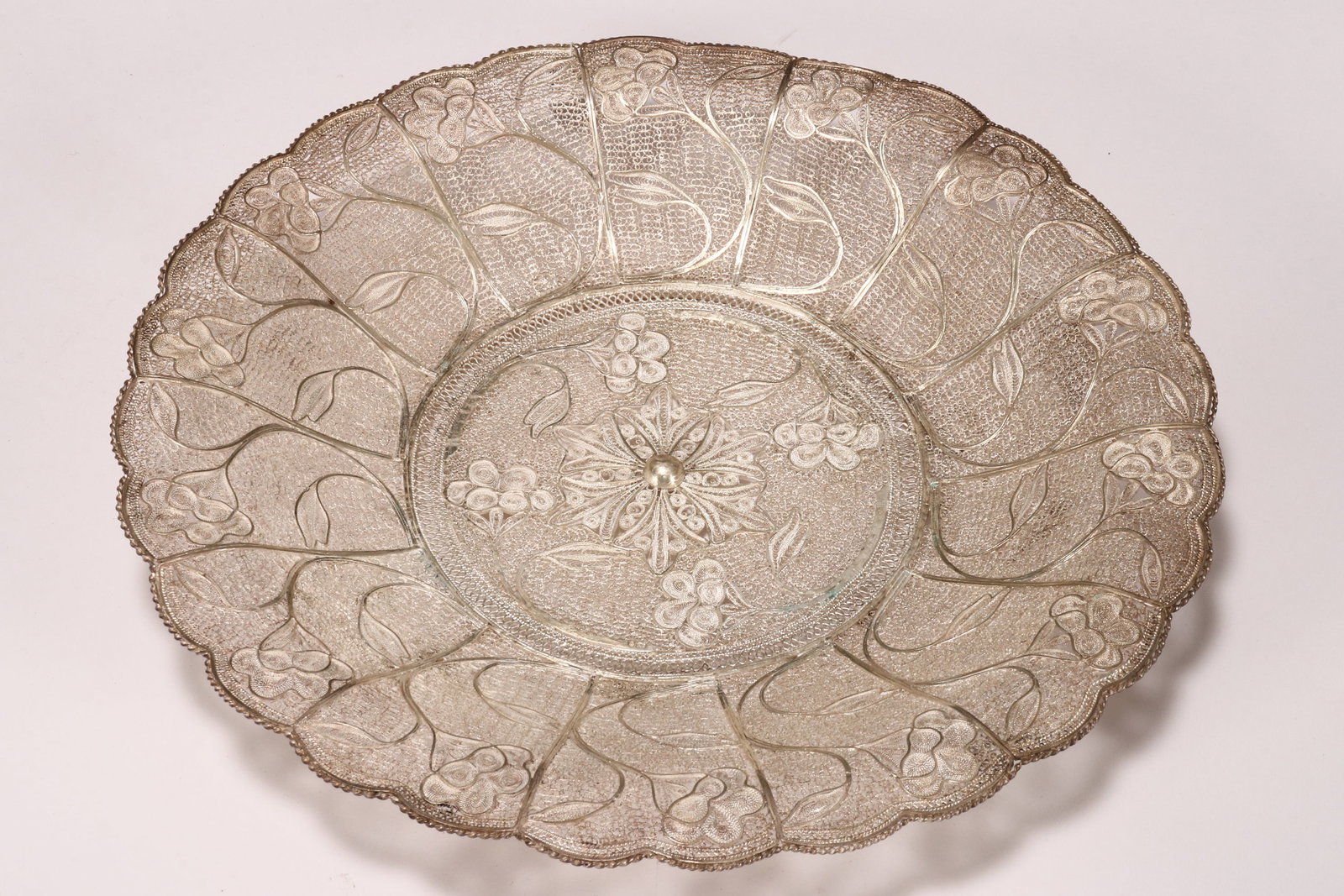 Albanian Sterling Silver Filigree Wall Plaque,: stamped to rear 'Albania', the front with Polish 925 sterling silver Warsaw mark and import cartouche, of circular form with a scalloped rim, decorated with stylised floral motifs, total weight 337g, 