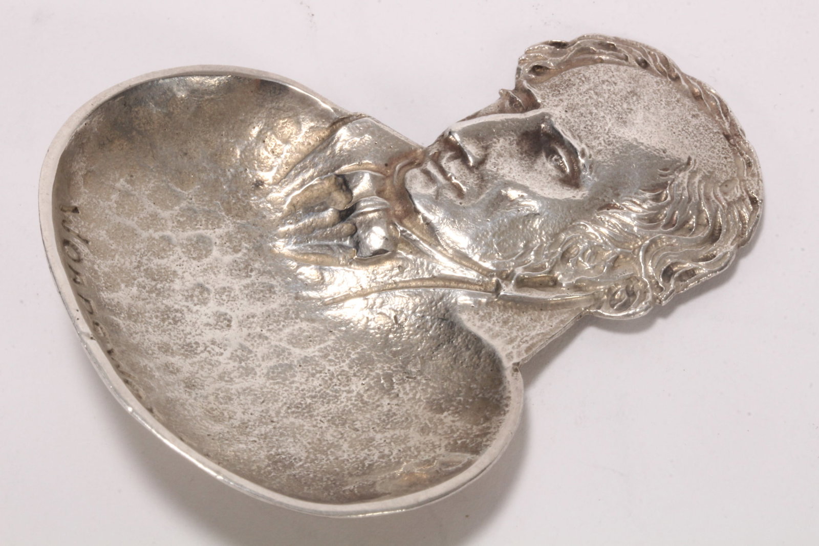 George V Sterling Silver 'Wordsworth' Caddy Spoon,: hallmarked Birmingham, 1929, Bernard Instone, the handle in the form of William Wordsworth, above an oval hand beaten bowl, total weight 24g, length 6.5cm
