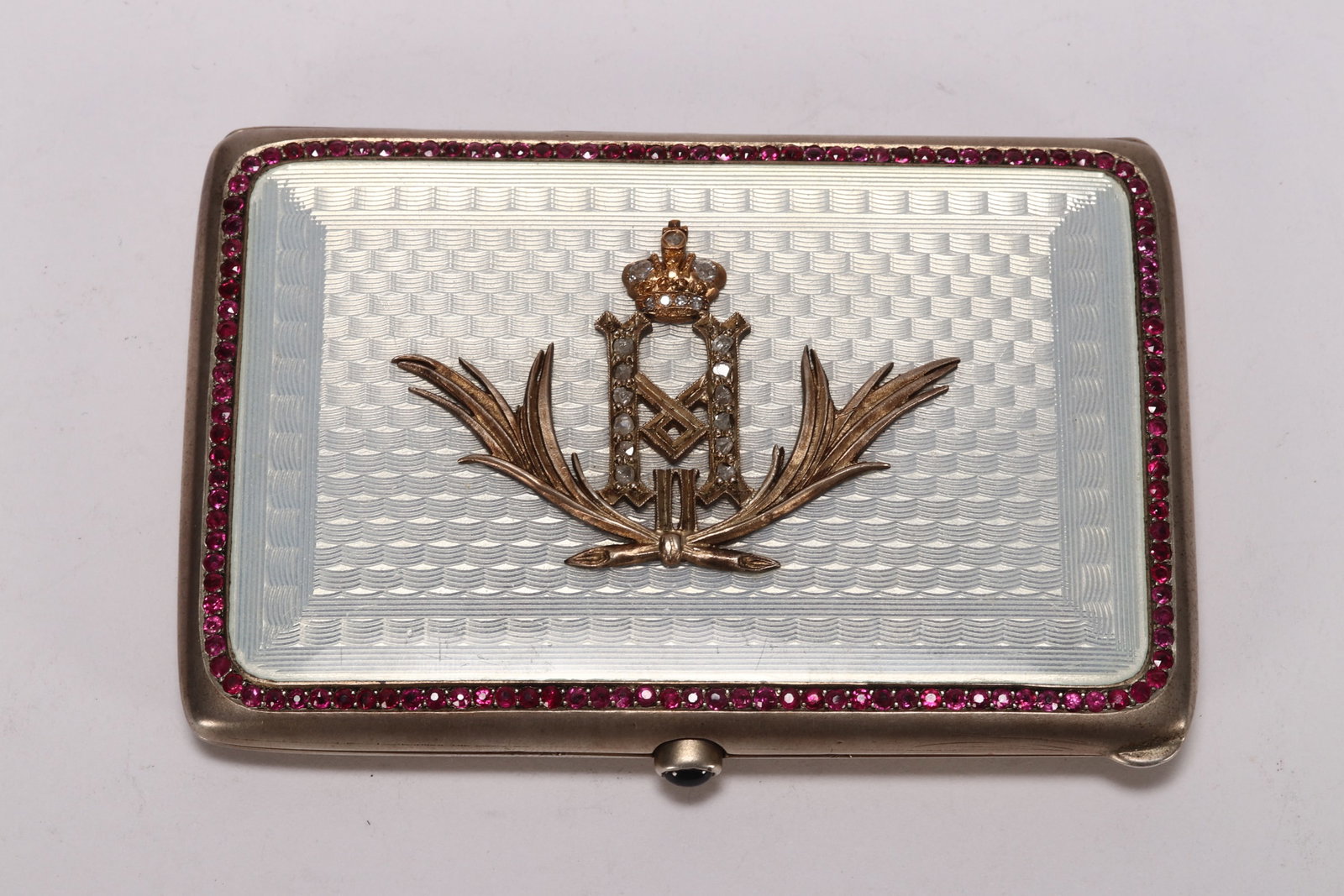 Russian Gold, Silver and Enamel Card Case,: of fine rectangular form, the cover decorated with coronet and monogram above wreath motif, on a white guilloch? ground, the whole set with eighty rubies and diamonds, with ruby button and inscription