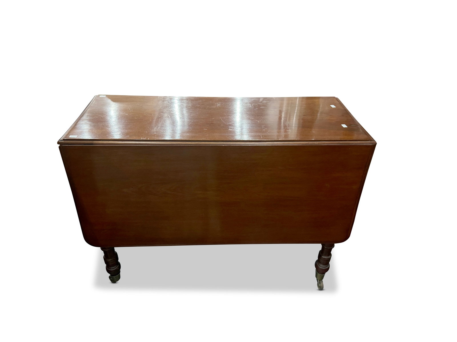 Australian Double Drop Side Cedar Table,: with a rectangular top set with hinged d-ends, on four turned legs on casters, 72cm x 97cm