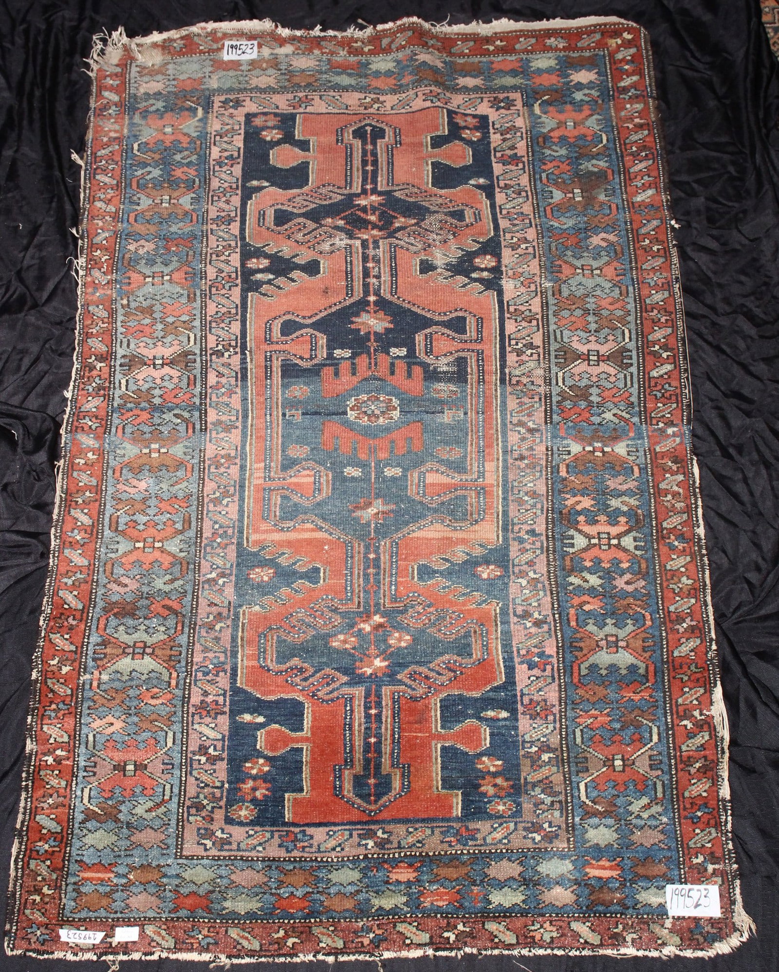 Persian Zanjan Rug,: of rectangular form, the central panel displaying geometric motifs and stylised flowers, surrounded by three borders of floral motifs, in tones of blue, red, pink and green, a/f, 117cm x 87cm