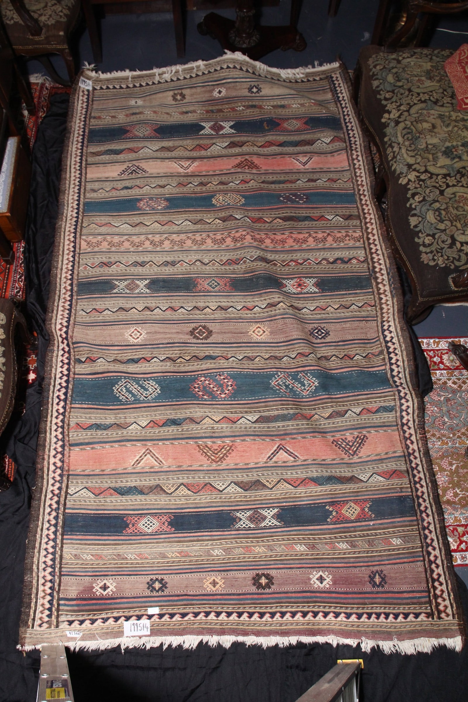 Kilim Rug,: of rectangular form, decorated with multiple bands displaying geometric motifs, in tones of red, blue, brown and white, 283cm x 157cm