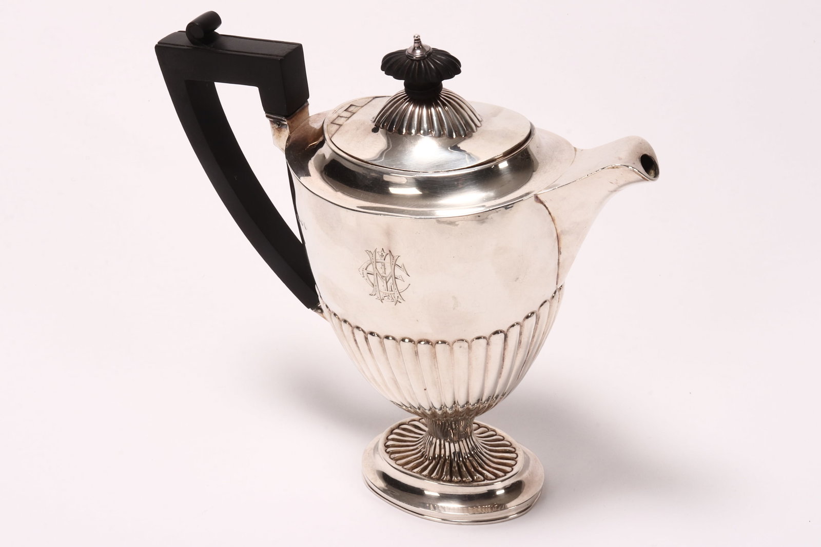 Victorian Sterling Silver Coffee Pot,: hallmarked London, 1889, makers mark rubbed (possibly Charles Stuart Harris), of tapering form, the lobed cover set with colonial style finial, above a lobed lower body with engraved monogram, with eb