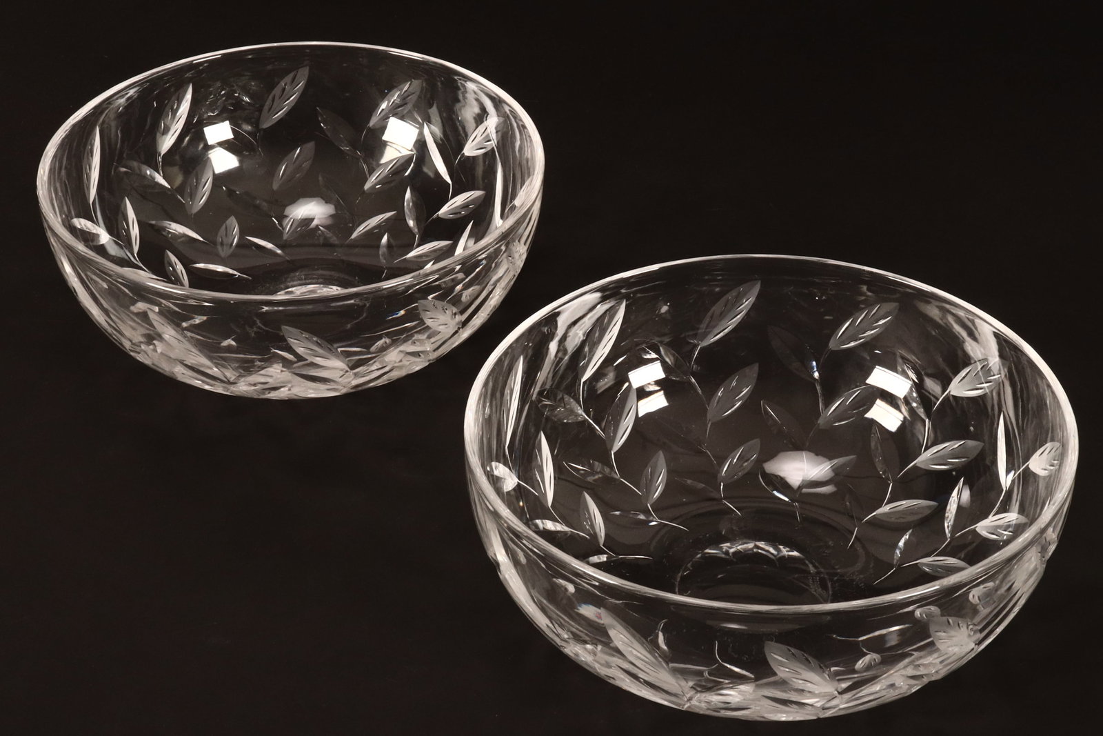 Large Pair of Stuart Crystal Bowls,: of deep conventional form, decorated continuously with acid etched foliate sprays, factory mark to base, height 11.5cm and diameter 27.5cm (2)