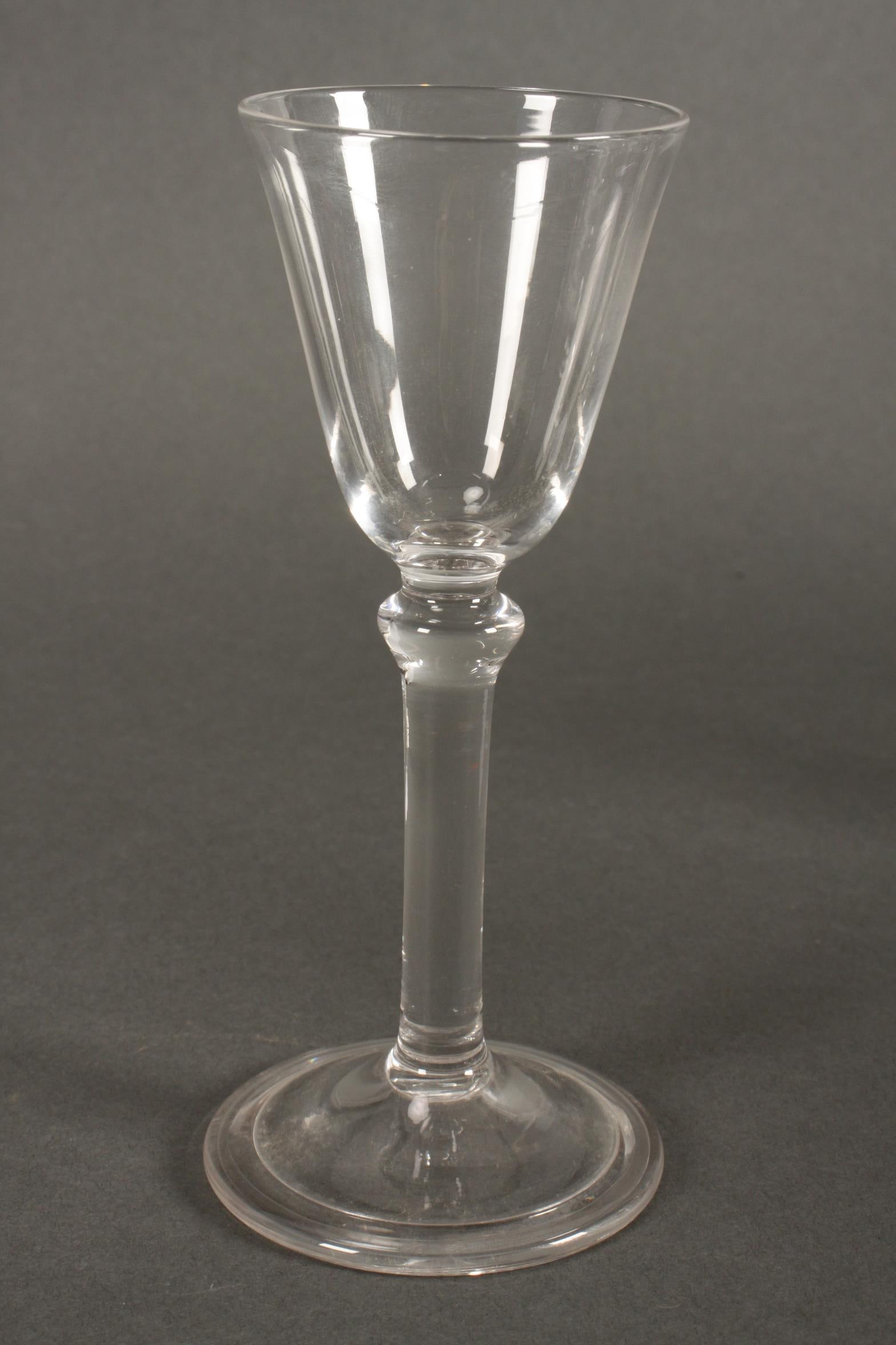 19th Century Light Baluster Stem Wine Glass,: with conical bowl, above a knop stem and circular fold foot, height 15.5cm