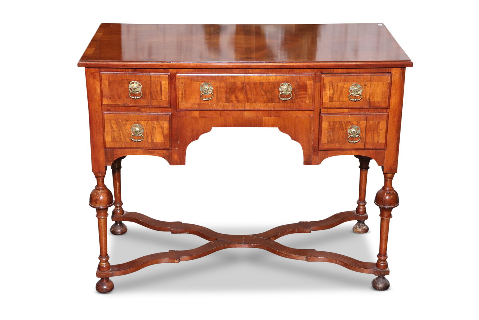 Lovely 19th Century William and Mary Style Knee Hole Desk,: with a quarter sawn and cross banded top, above a central drawer flanked by two short drawers to one side and one single drawer to the other acting as one drawer, the whole raised on four slender turn