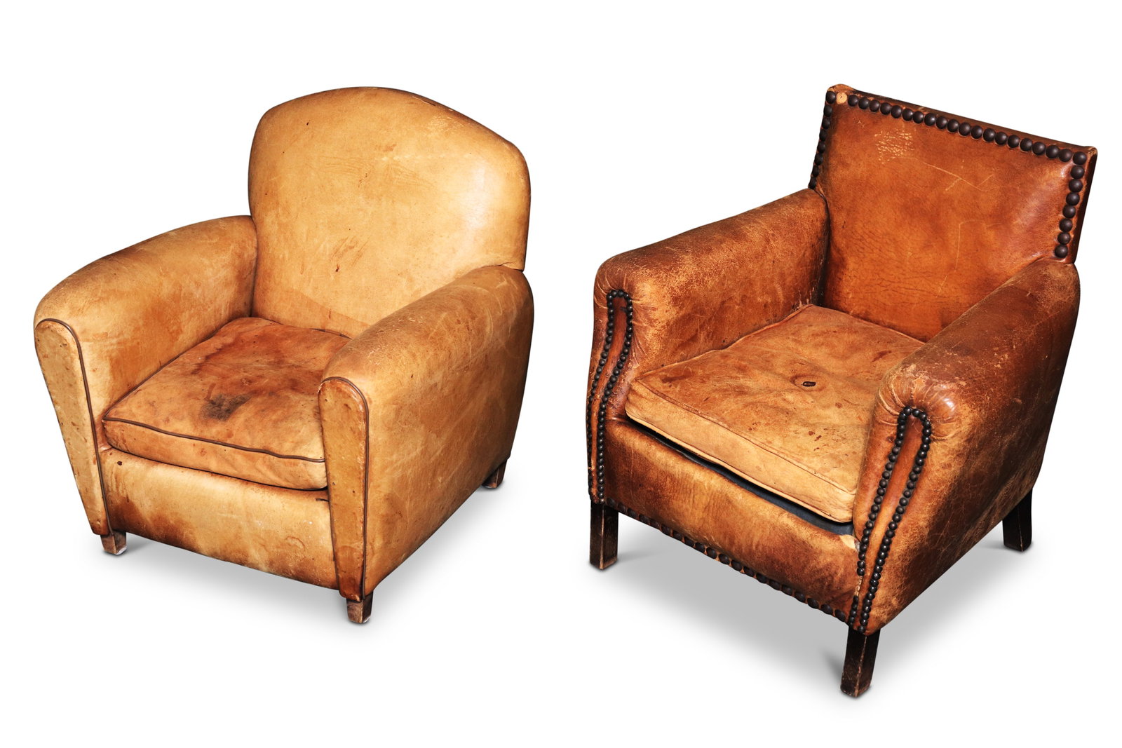 Two French Children's Art Deco Leather Armchairs,: in brown leather, a/f (surface wear consistent with age, missing nail), height 62cm and 58cm (2)