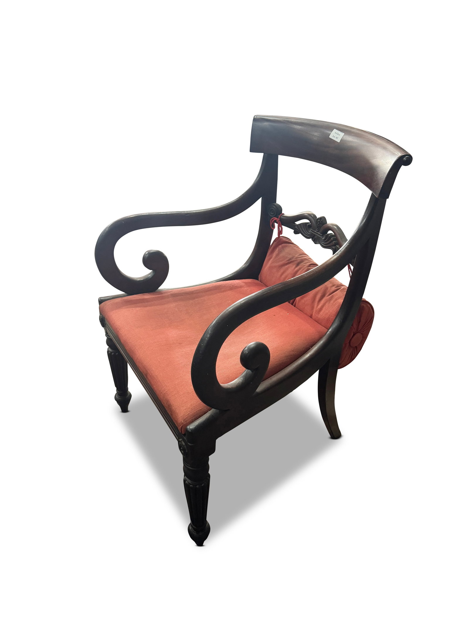 Regency Rosewood Carver,: with curved crest rail, above a well carved horizontal splat, with attached cushion and drop in seat, flanked by a pair of scrolled arms with reeded apron, on four reeded legs, height 86cm x width 56c