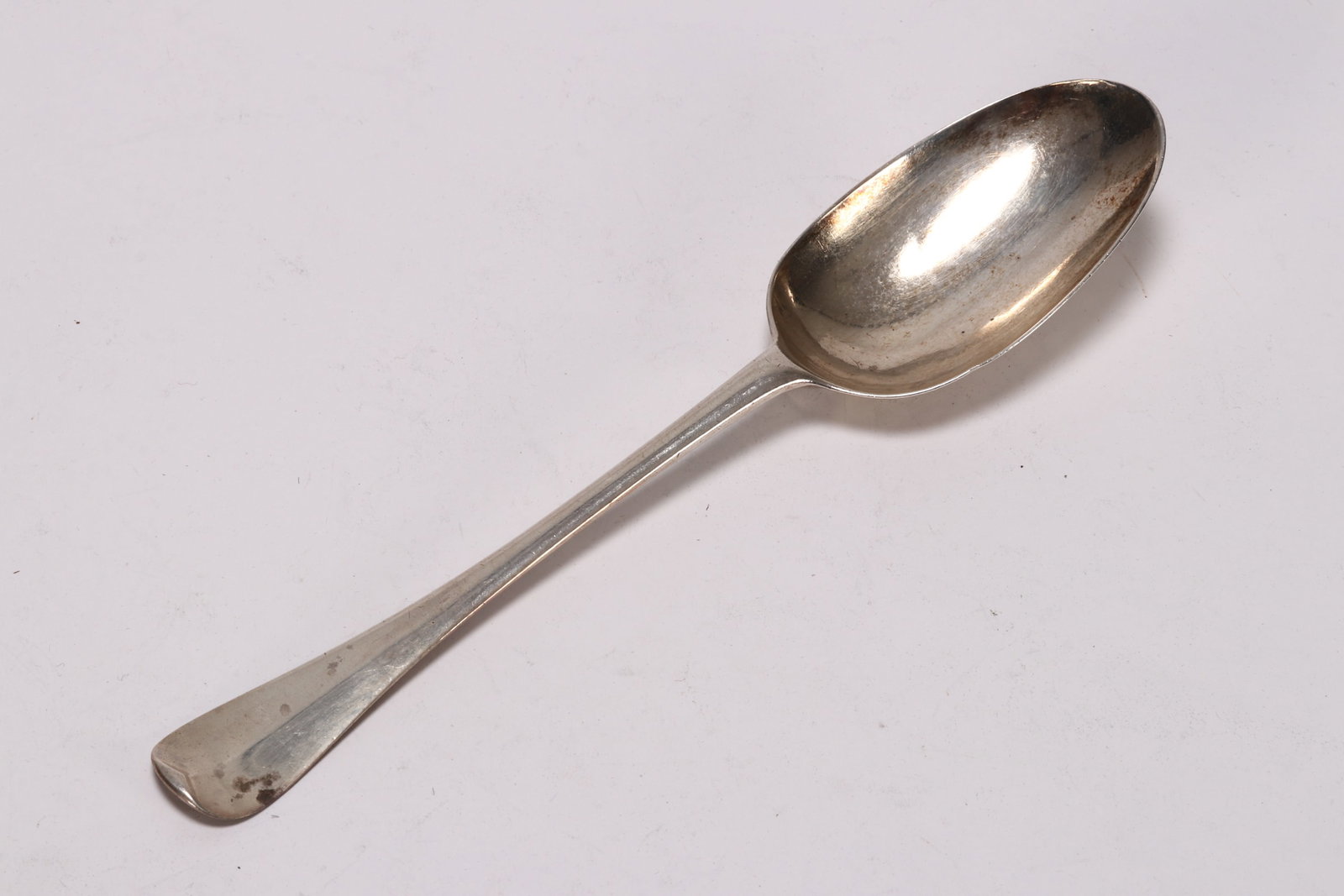 Queen Anne Britannia Silver Table Spoon,: hallmarked London, 1712, Br (John Broake), in Hanoverian pattern with rat tail, with engraved 'M*I' to reverse of terminal, total weight 45g, length 19.5cm