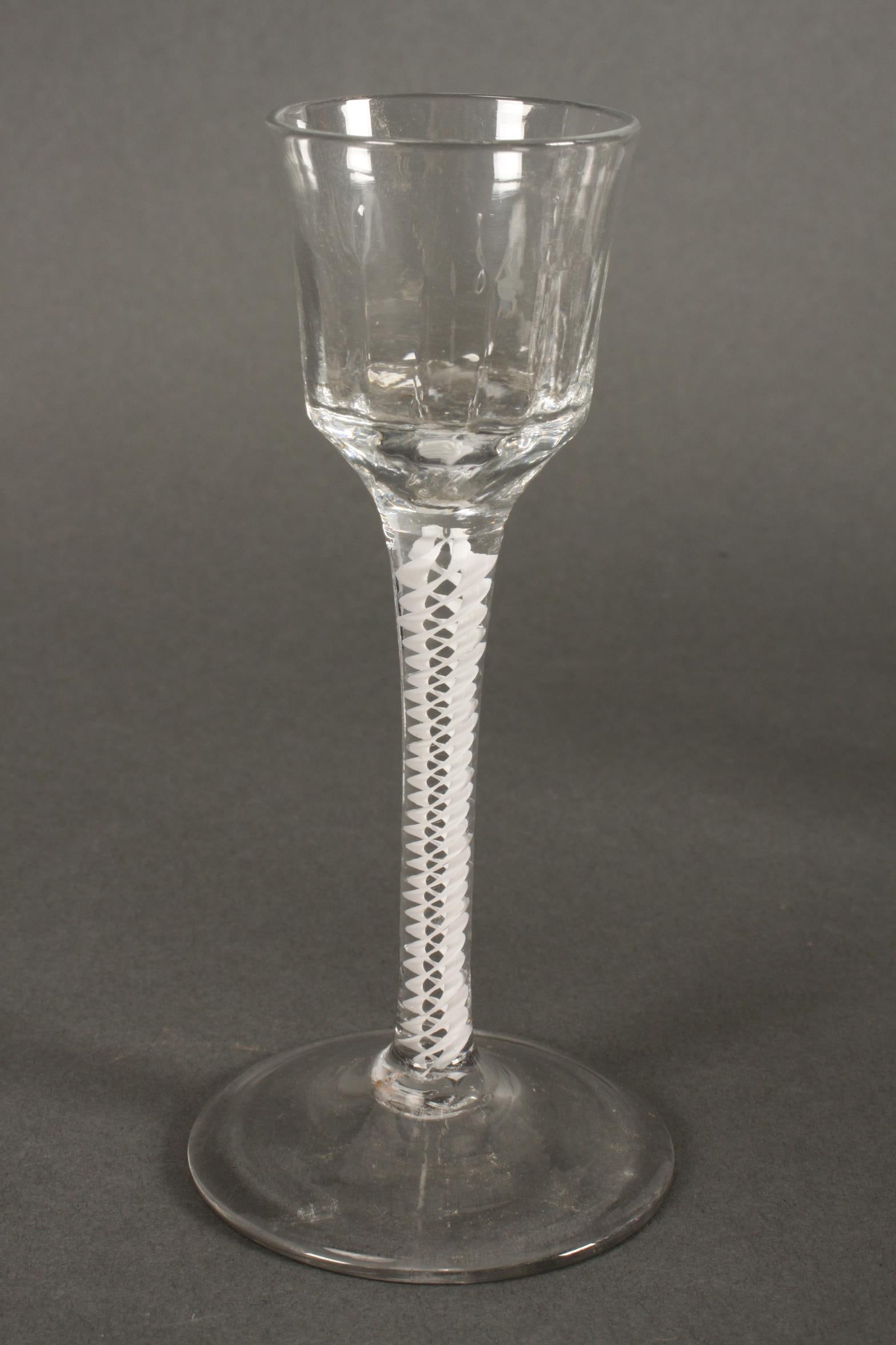 Georgian Opaque Twist Stem Wine Glass, c.1760,: with facetted bell shaped bowl, on a circular foot, height 15.5cm