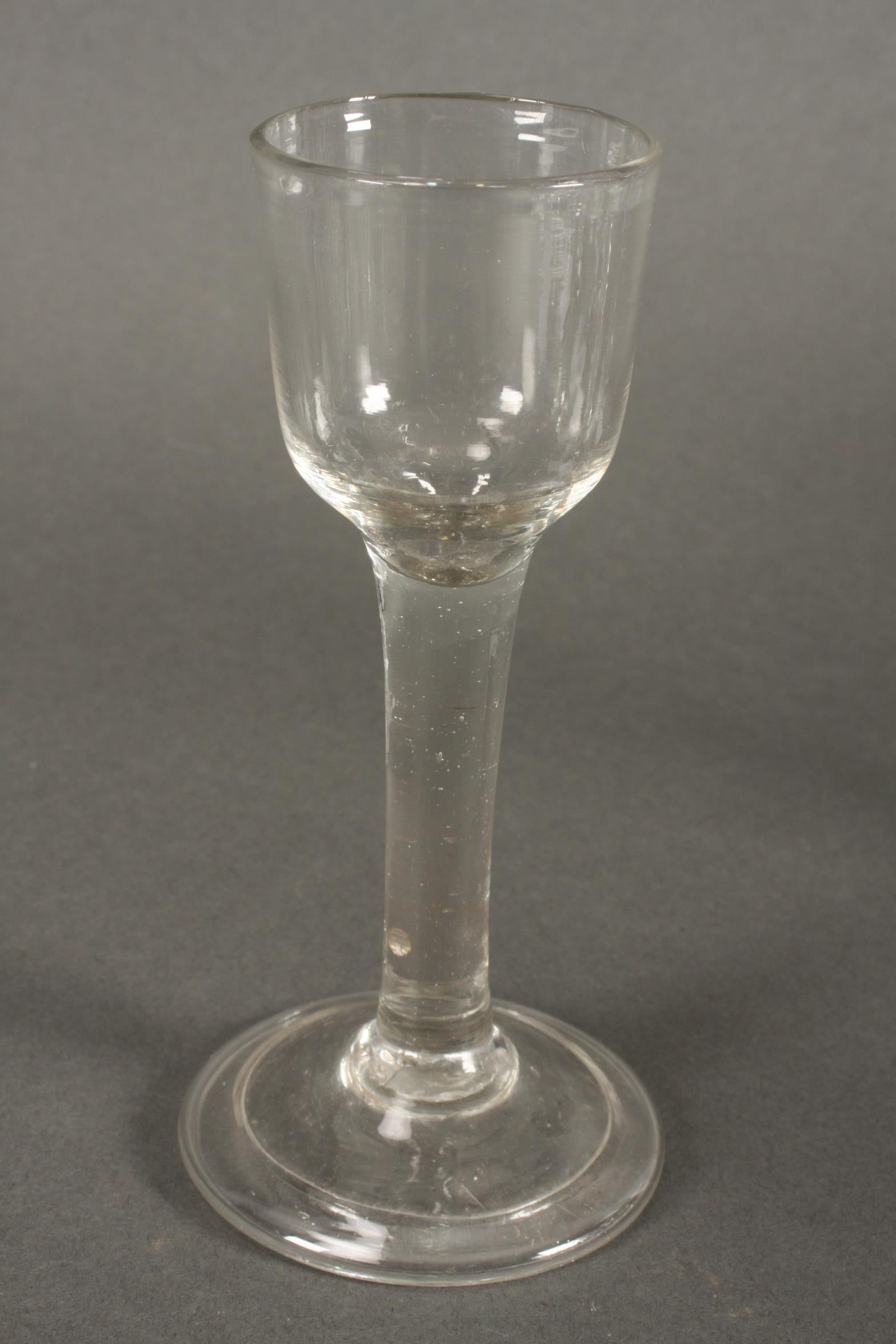 Georgian Plain Stem Wine Glass, c.1760,: with bucket shaped stem and circular fold foot, height 15cm
