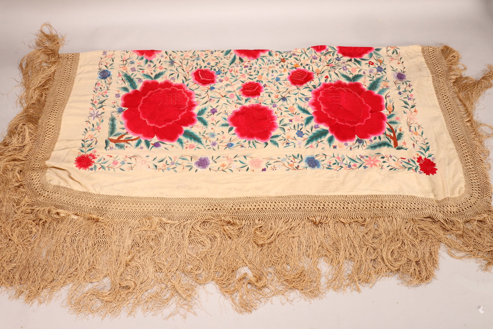 Early 20th Century Silk Piano Shawl,: with embroidered foliate design and knotted fringe, in polychrome tones on a cream ground, 225cm x 225cm (including fringe)
