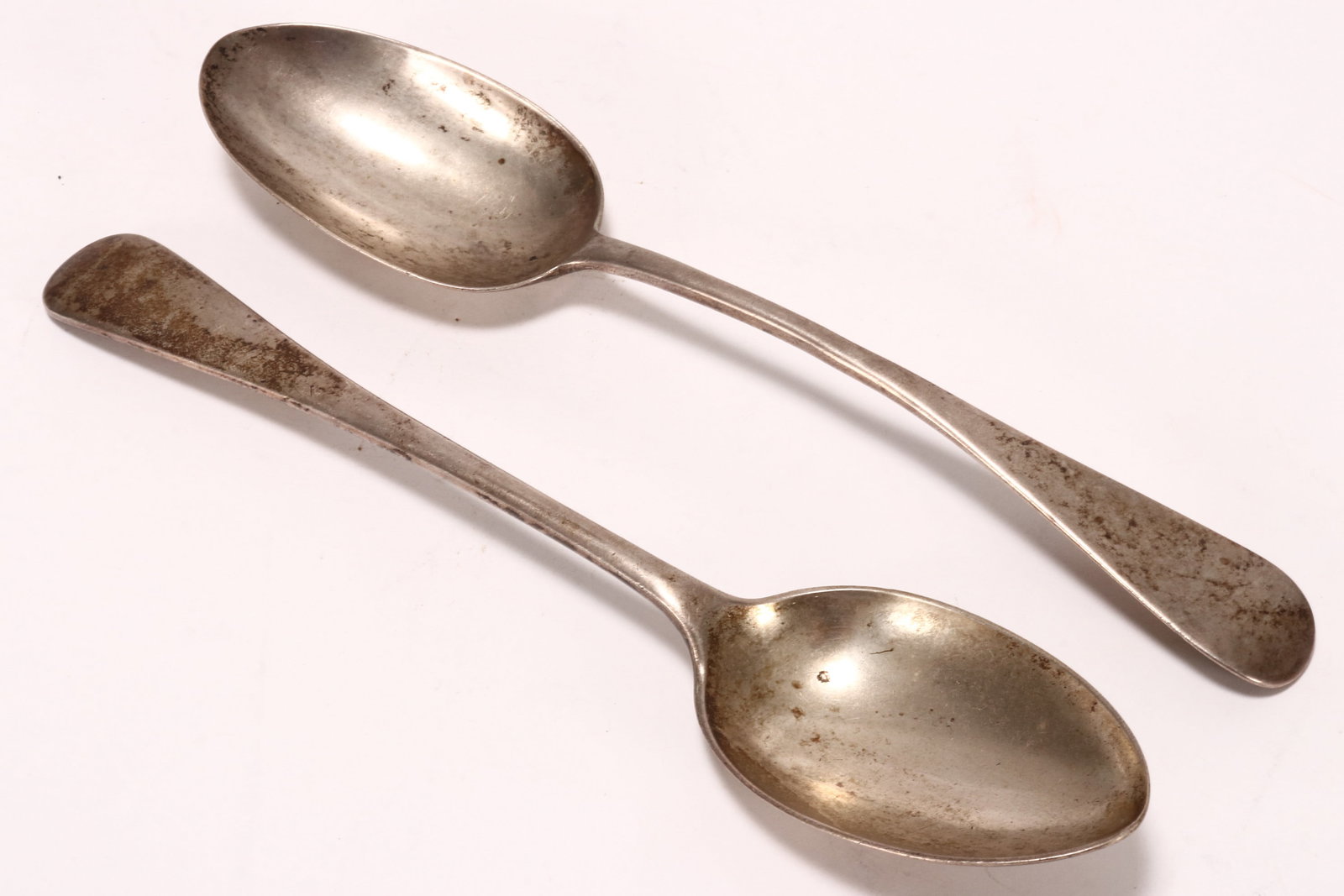 Two Victorian Sterling Silver Table Spoons,: one hallmarked London, 1853, G.A, the other marked Sheffield, 1912, H.A, total weight 165g, length 22cm (2)