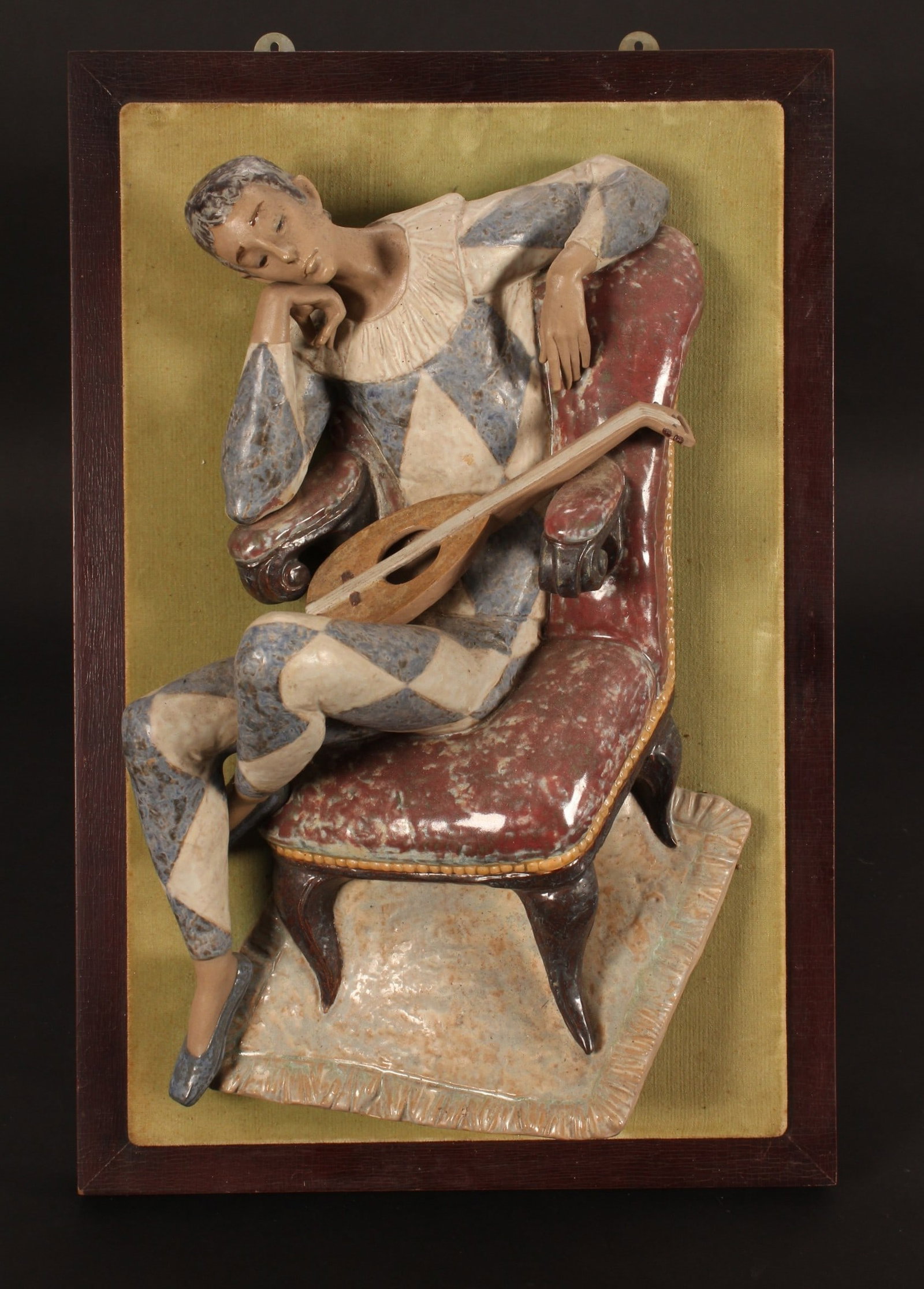 Impressive Lladro Harlequin Wall Plaque,: by Fulgencio García, c.1970's, with blue Lladro factory stamp towards the base, modelled with a seated pensive harlequin with lute positioned on lap, the figure measuring approx. 50cm in height, moun