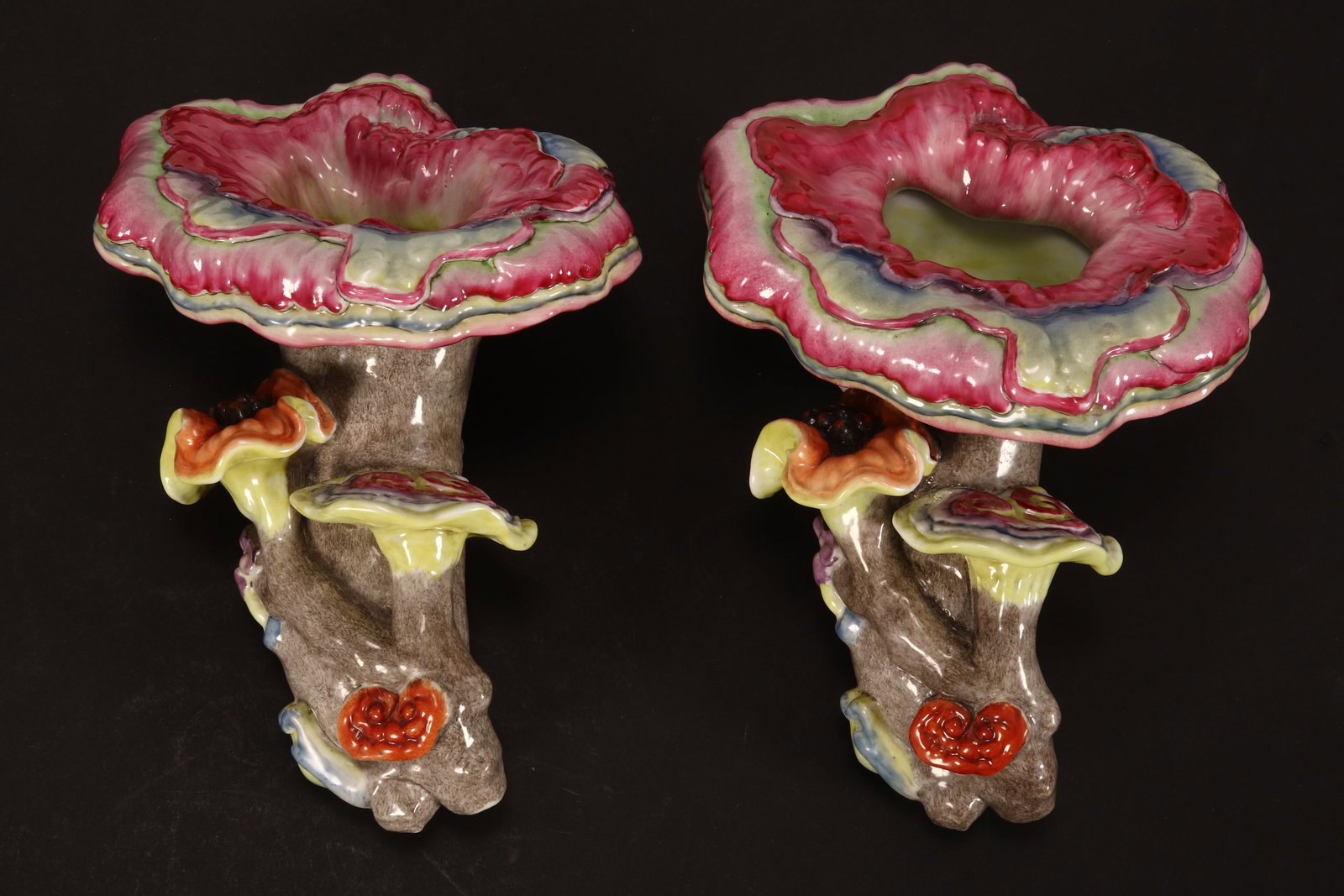 Pair of Chinese Polychrome Porcelain Wall Vases,: in the form of a branch with lingzhi, decorated with smaller lingzhi and flower below, in tones of pink, green, orange and blue, six character mark to verso, length 20cm (2)