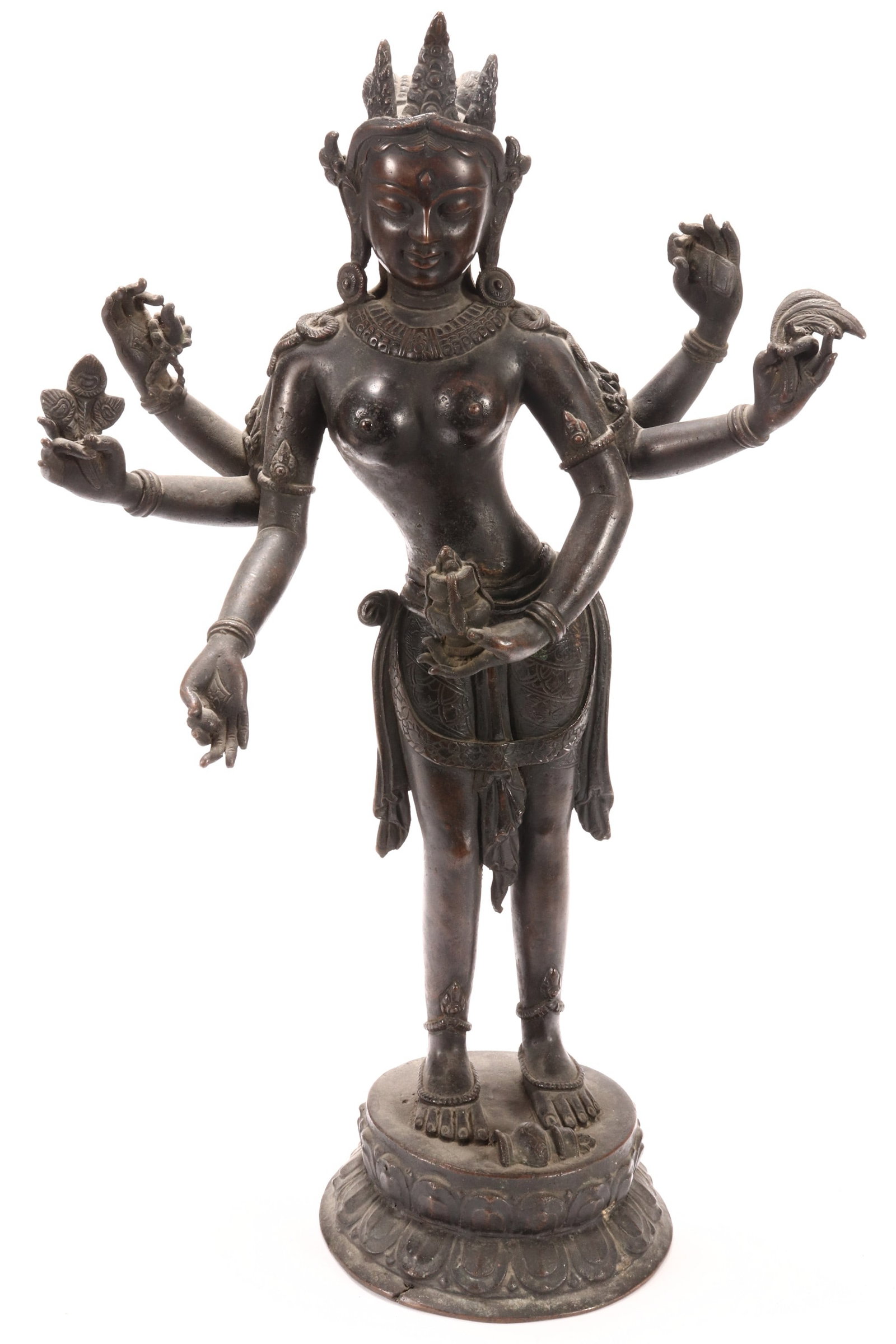 Sino-Tibetan Bronze Vasudhara Figure,: depicted standing, with elaborate headdress and content downwards gazing expression, with six arms each clutching an attribute, above a double lotus base, height 46cm