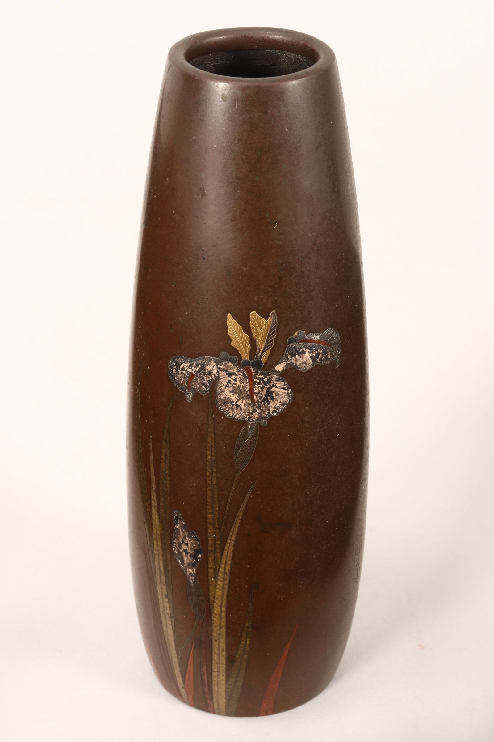 Japanese Bronze and Mixed Metal Inlaid Vase,: of ovoid form, the body decorated with a spray of blossoming iris, in tones of green, red, black and tan, with gilt accents, mark to base (Nogawa), height 15cm