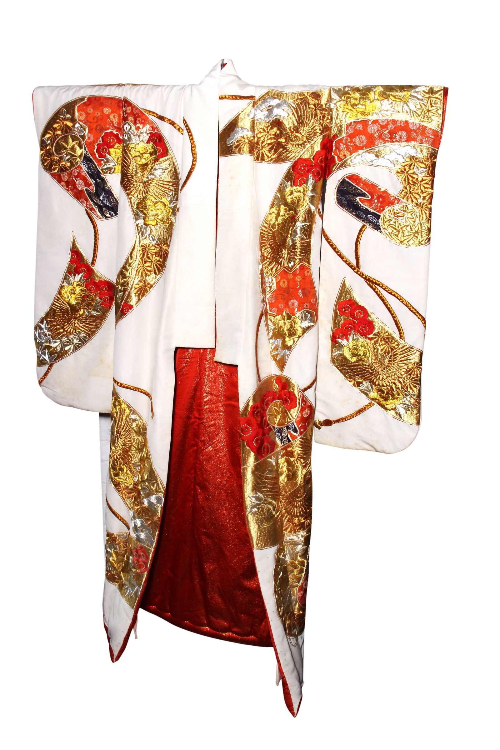 Japanese Uchikake,: the exterior decorated with tabane-noshi reserves containing gold-work embroidered cranes and blossoming foliates, with trailing cords, in tones of gilt, silver, blue and orange on a cream ground, con