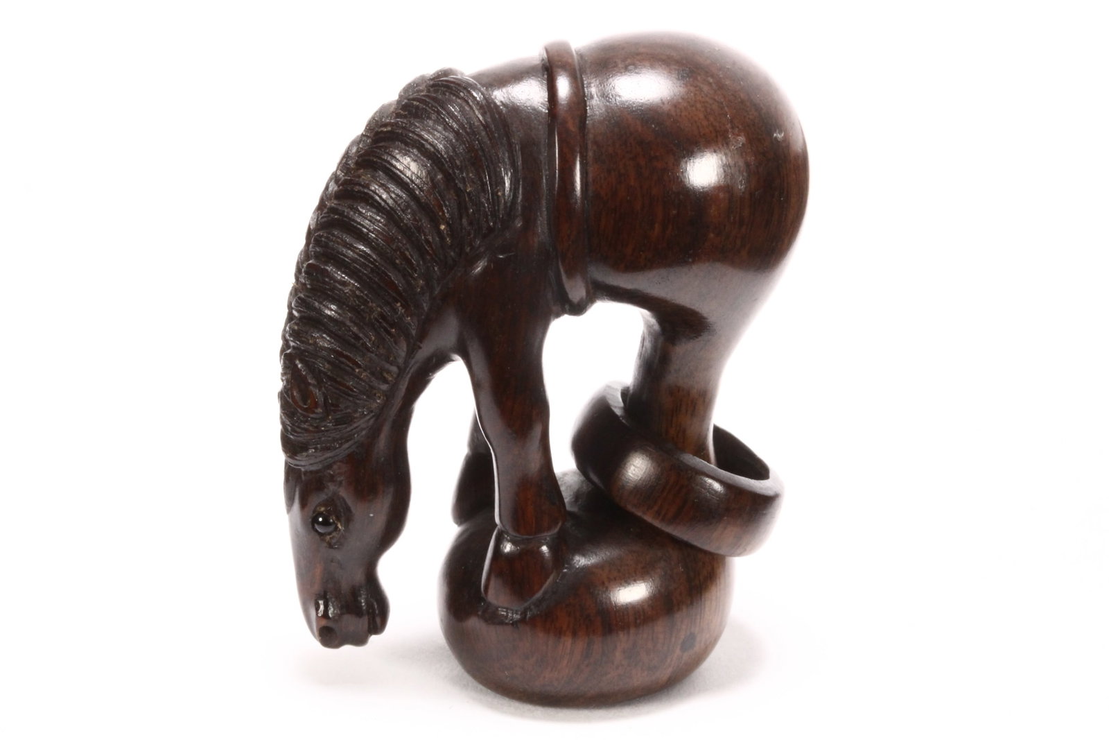 Japanese Wooden Netsuke,: carved in the form of a horse perched on a ball with ring around legs, height 5cm