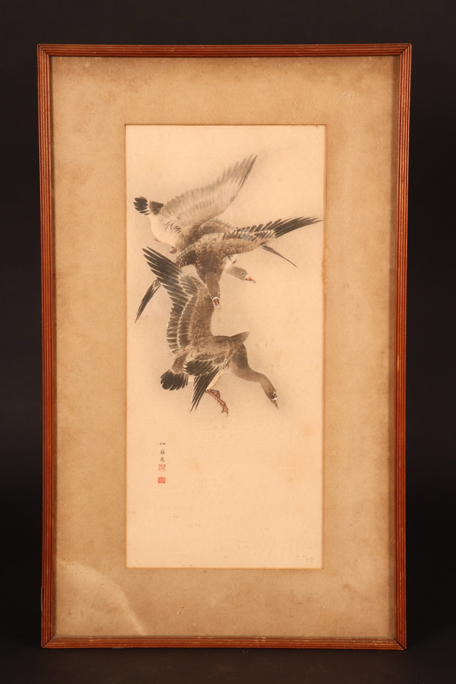 Framed Japanese Watercolour,: depicting three geese in flight, signed and seal mark, 41.5cm x 18cm
