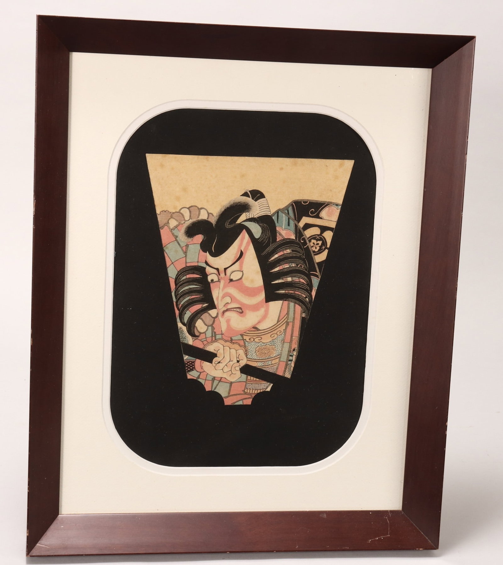 Utagawa Kunisada Woodblock Print,: the fan shaped kabuki woodblock print of Ichikawa Danjuro VII as Soga no Goro in Yanone, on black mount, 27cm x 22cm (fan shape), on black paper mount with frame, frame 56cm x 45cm