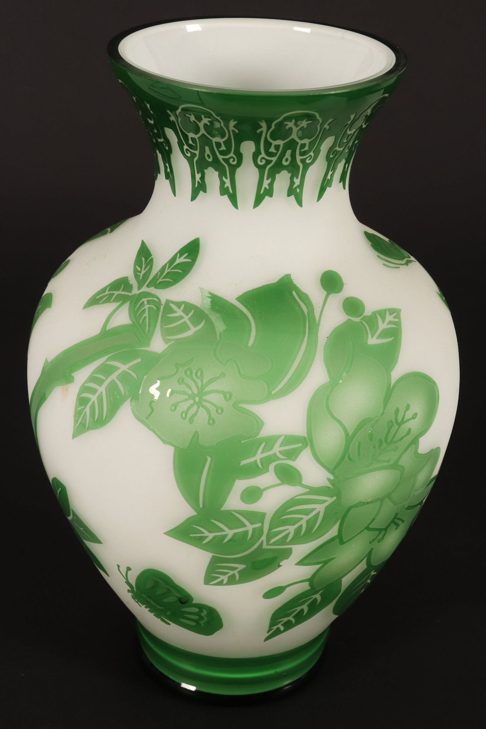 Large Chinese Peking Cameo Glass Vase,: of baluster form, with decorative neck, above a ground of flowering trees and butterflies, in tones of green on a white ground, height 27.5cm
