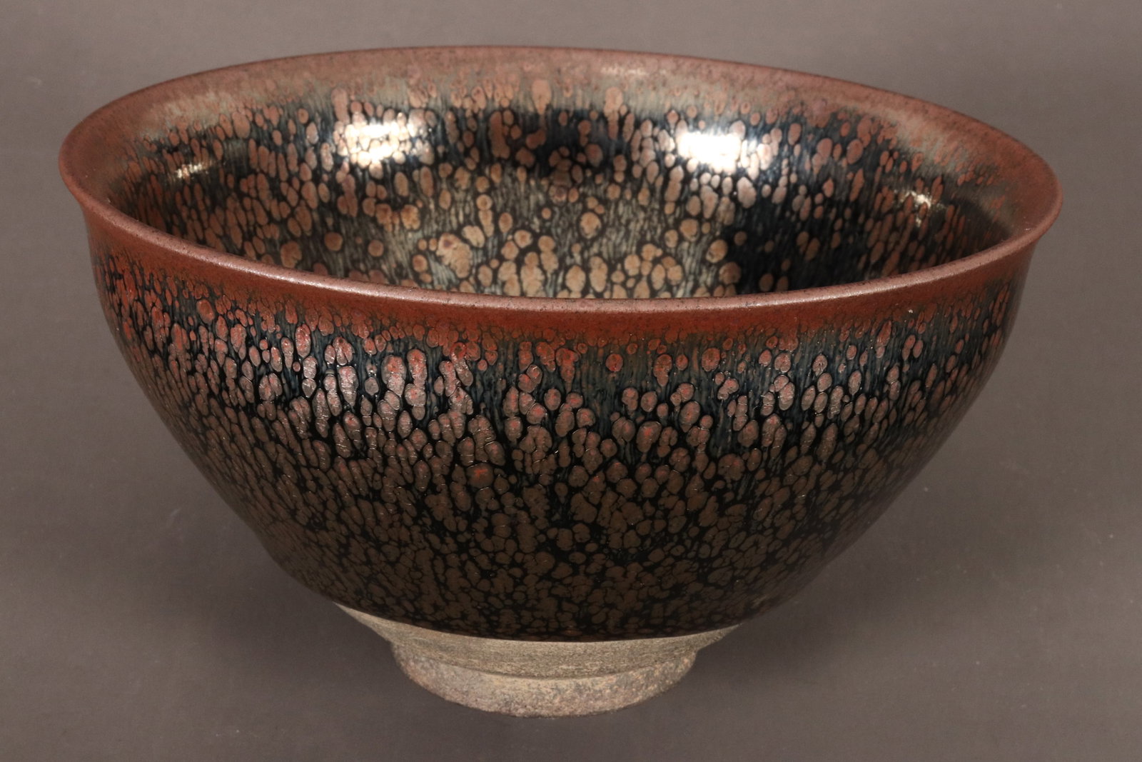 Chinese Oil Spot Glaze Bowl,: of conical form with a slightly flared rim, standing on an exposed circular foot, incised mark to base, height 7cm and diameter 12.5cm