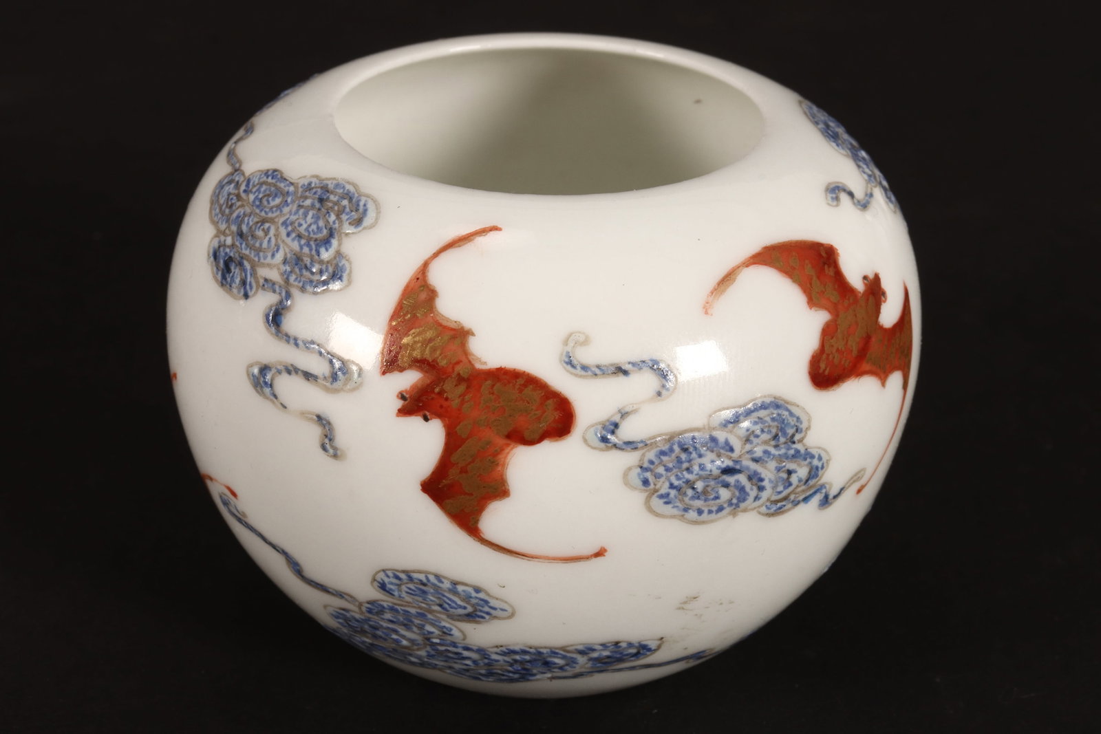 Chinese Porcelain 'Bat' Water Pot,: of globular form, decorated continuously with bats amongst stylised clouds, in tones of blue, orange and gilt on a white ground, six character mark to base, a/f (hairline), height 4.5cm and diameter 6