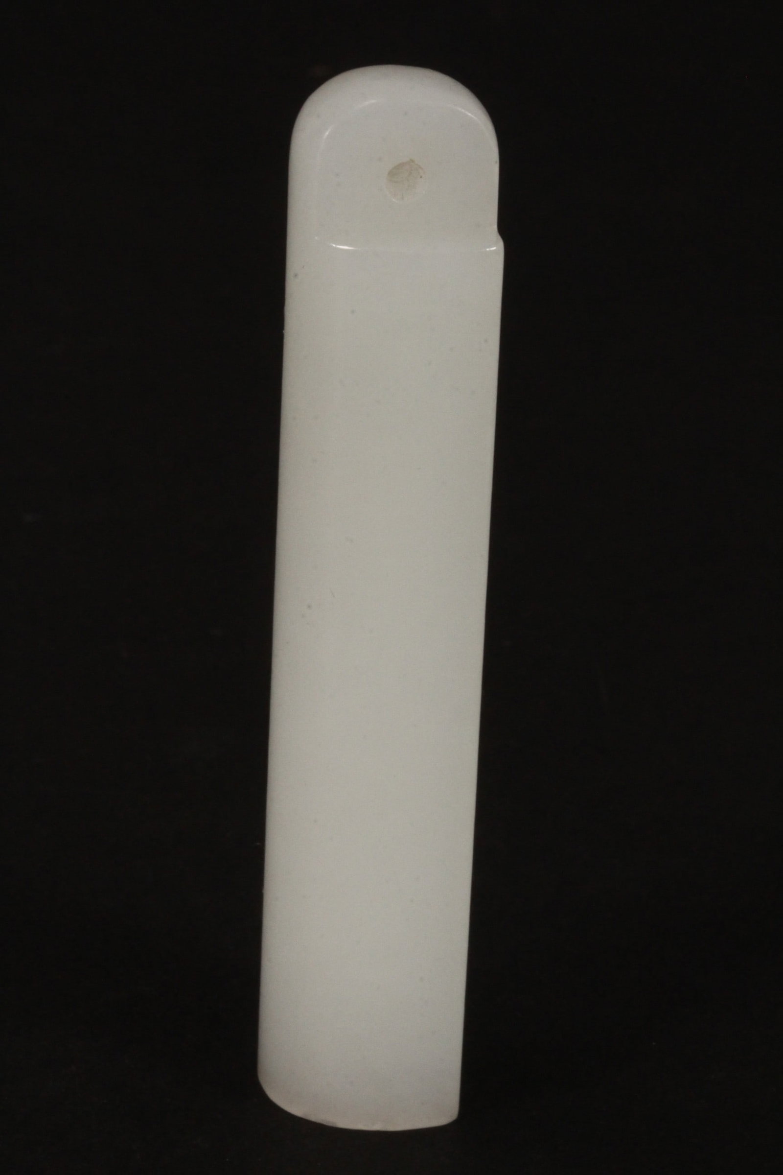 Chinese Carved White Jade Hat Finial,: of plain cylindrical form, with a pierced tab to one end, length 7.5cm
