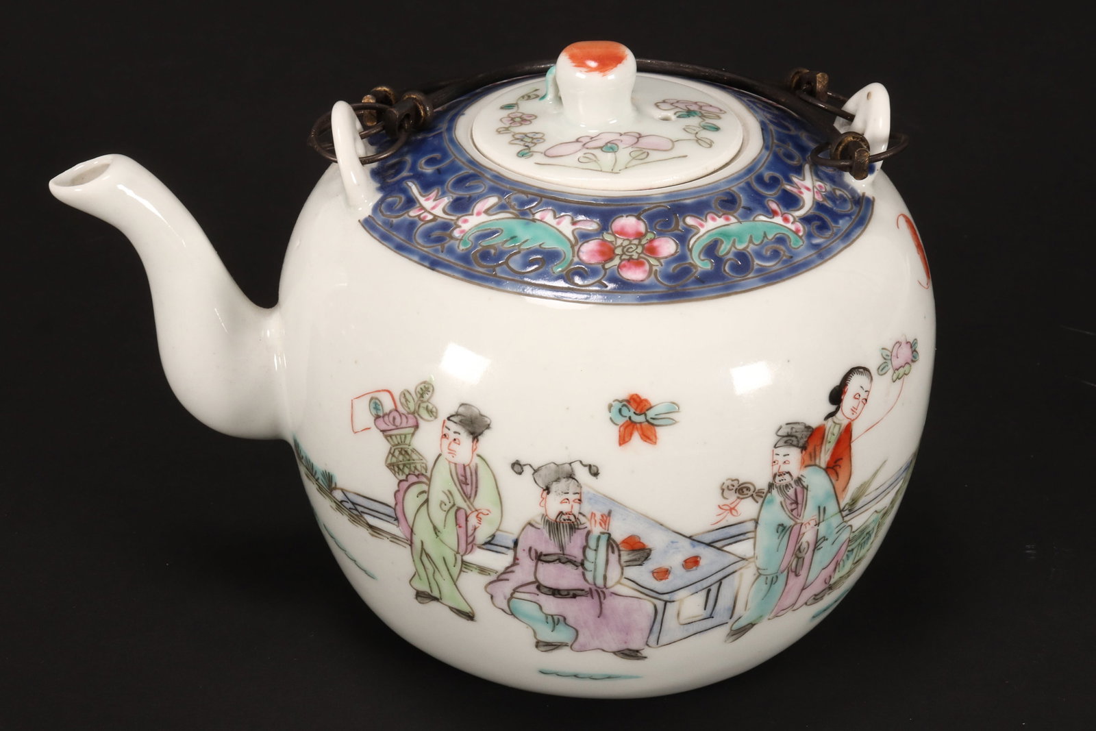 Chinese Porcelain Teapot,: of globular form with double swing handles, the cover set with peach finial and decorated with floral sprays, the body with a band of scrolled lotus, above a garden scene with figures and bats, in pol