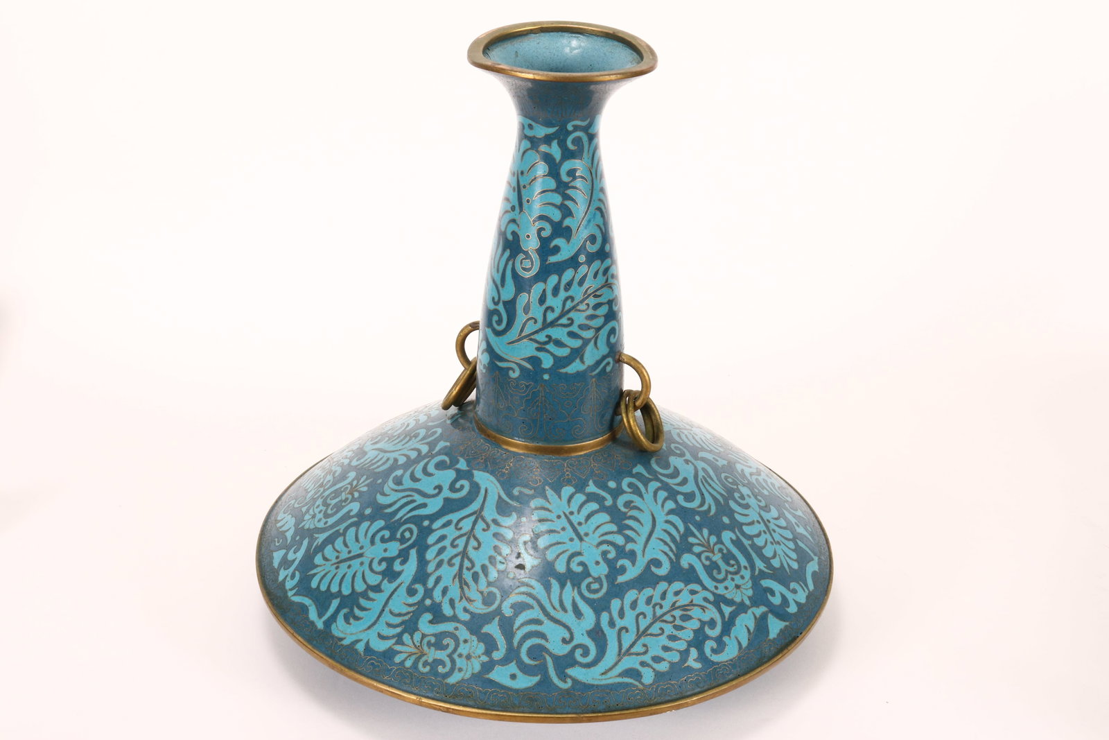 Unusual Chinese Cloisonne Vase,: with a flared rim and elongated neck above a spreading base, set with double drop ring handles, the whole decorated with stylised foliates, flanked by decorative borders, in tones of blue, raised on a