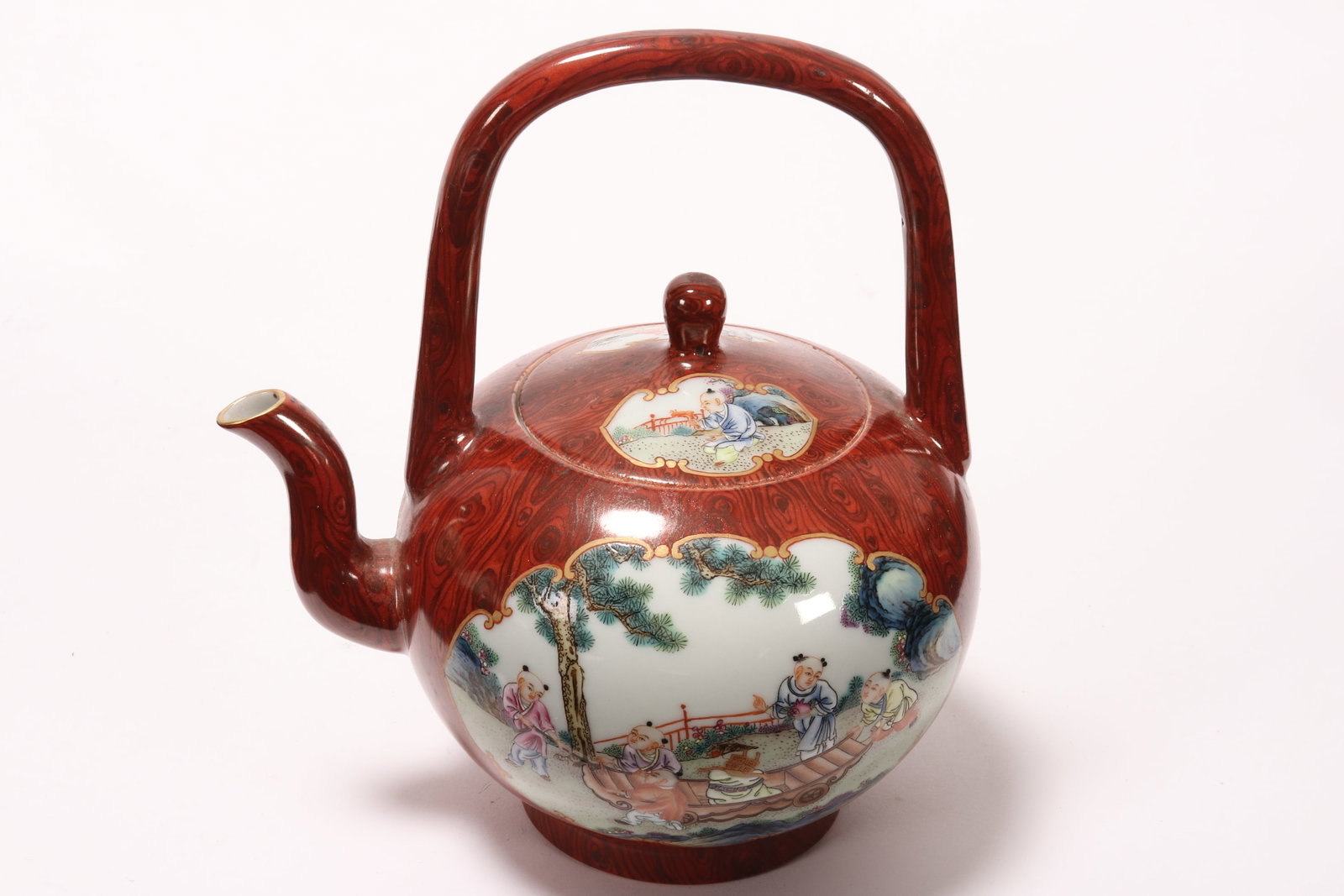 Chinese Wood Grain Porcelain Teapot & Cover,: of globular form, with over head handle and stylised spout, decorated with reserves depicting figures in an outdoor setting, on a ground imitating wood grain, in tones of blue, green, white and black 